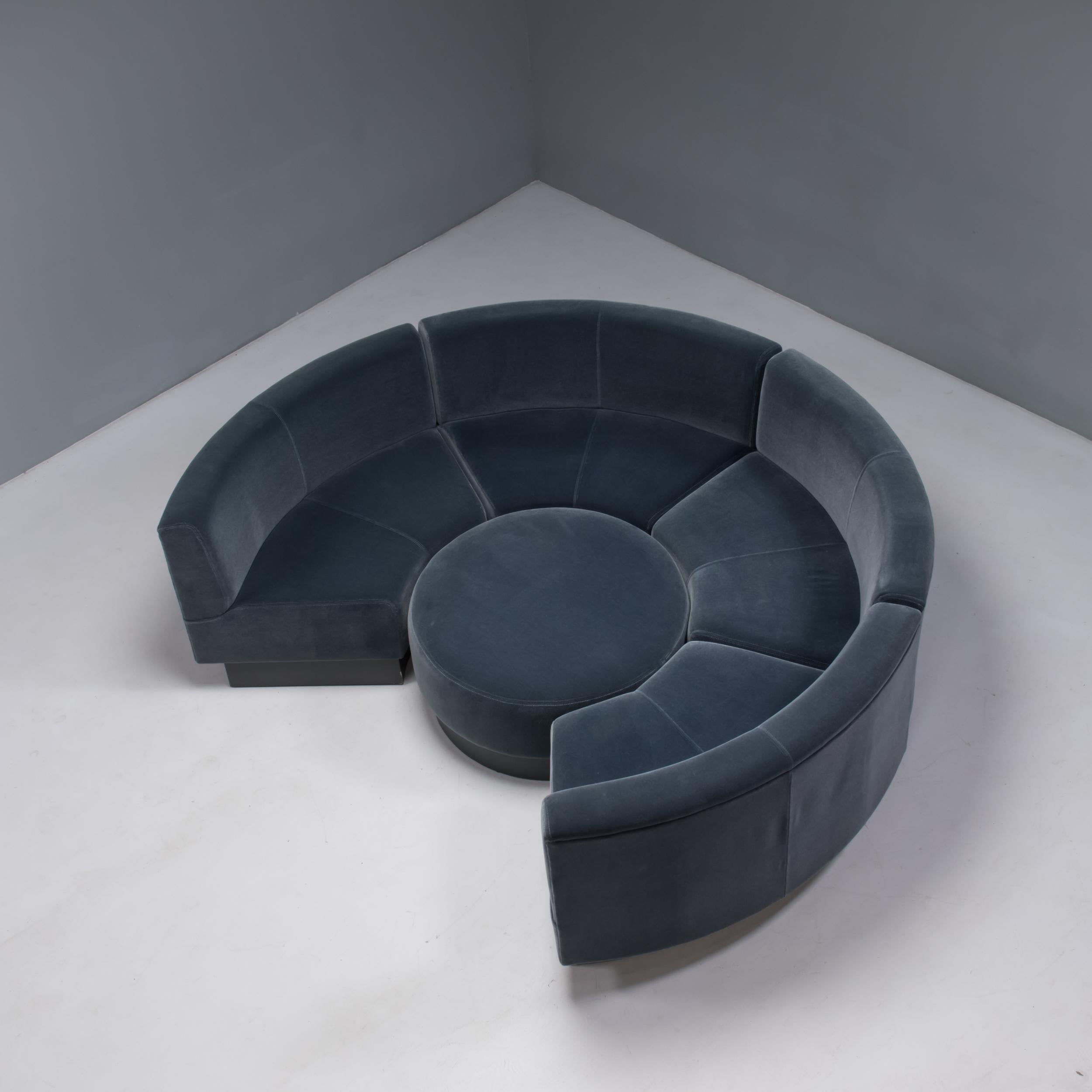 Created as a bespoke commission, this sofa is designed by Ilse Crawford and manufactured by George Smith in the UK, using traditional techniques.

Comprised of four curved modules, the sofa is fully upholstered in grey velvet and fits together to