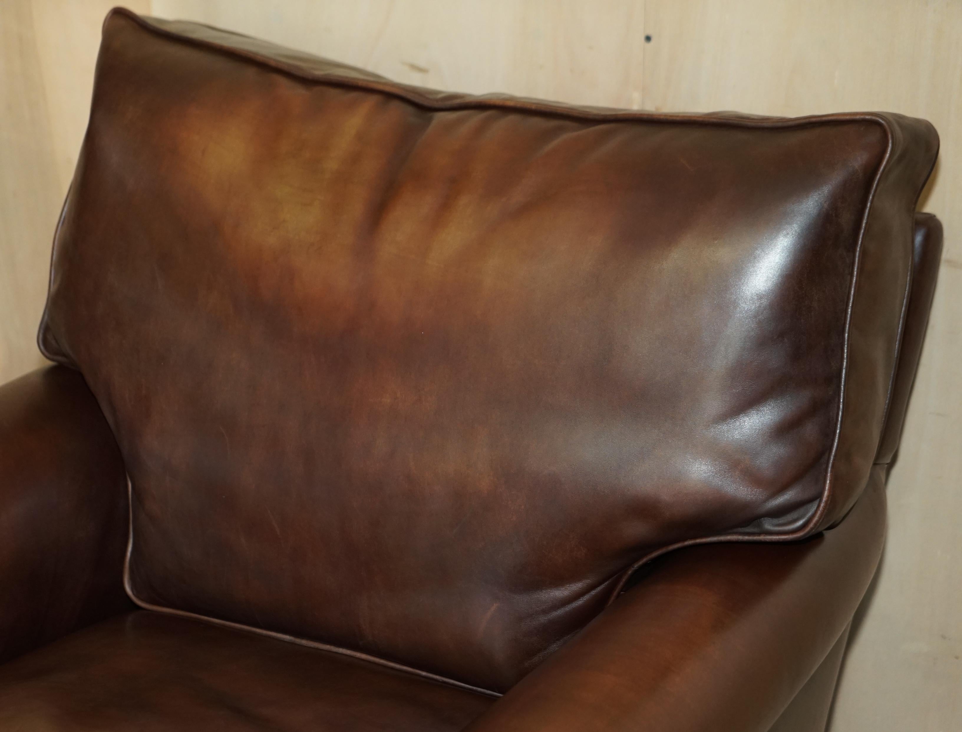 brown leather armchair and footstool