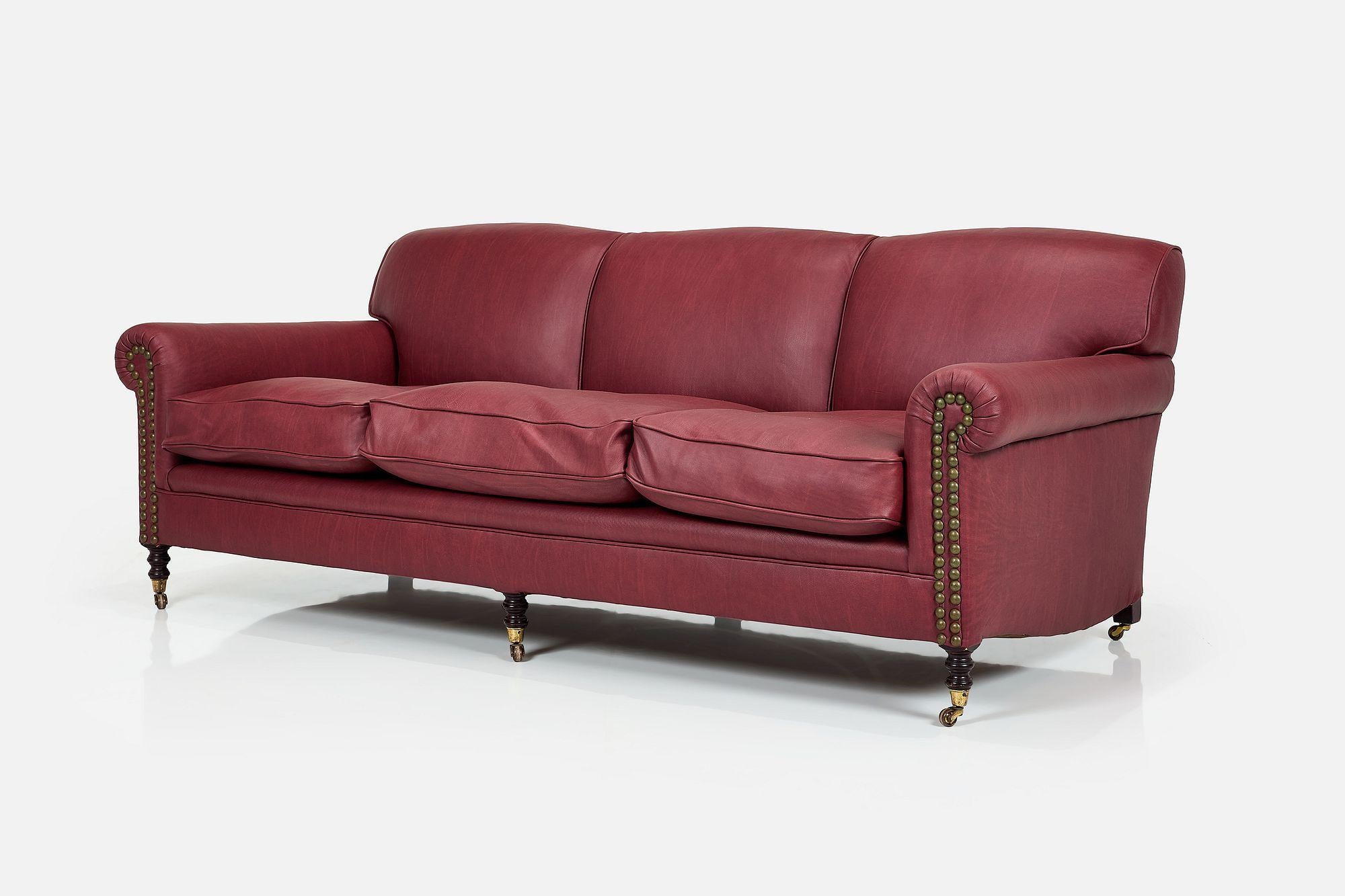 A stunning, expertly crafted, heirloom sofa by George Smith, circa 2000s. This large 3-seater has been expertly re-upholstered in a fabulous top-grain, oxblood leather which will get more and more beautiful with age and use. Other features include