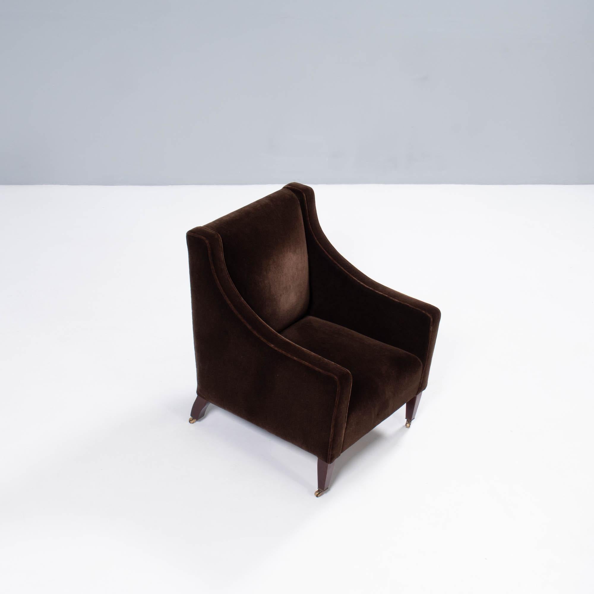 Designed and manufactured in the UK, using traditional techniques this Georgian armchair by George Smith combines classic design with modern comfort.

The chair has a fixed seat and is fully upholstered in brown velvet. The solid wooden legs are