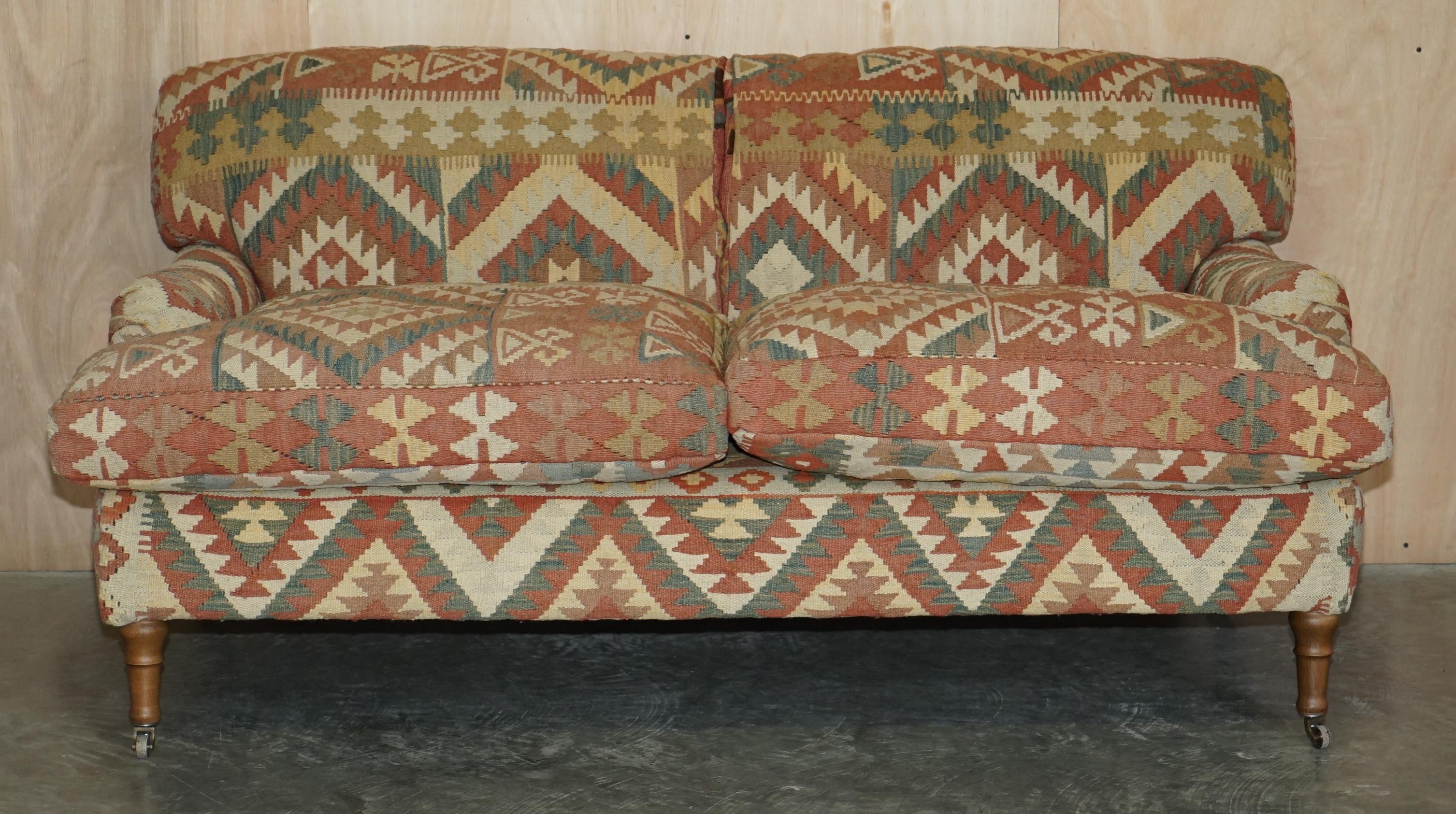 We are delighted to offer for sale this hand made in England, George Smith Signature Standard arm style, feather cushion back and base, Kilim and brown leather upholstered sofa with over stuffed feather filled cushions

A very good looking well