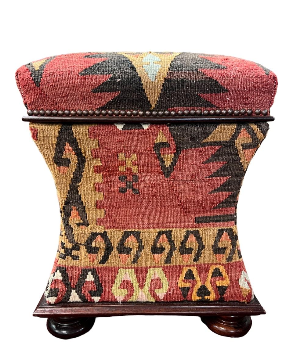 Crafted by George Smith, renowned for their fine furniture creations, this ottoman embodies the brand's commitment to quality and attention to detail. The Kilim upholstery is handwoven using traditional techniques, resulting in a stunning pattern