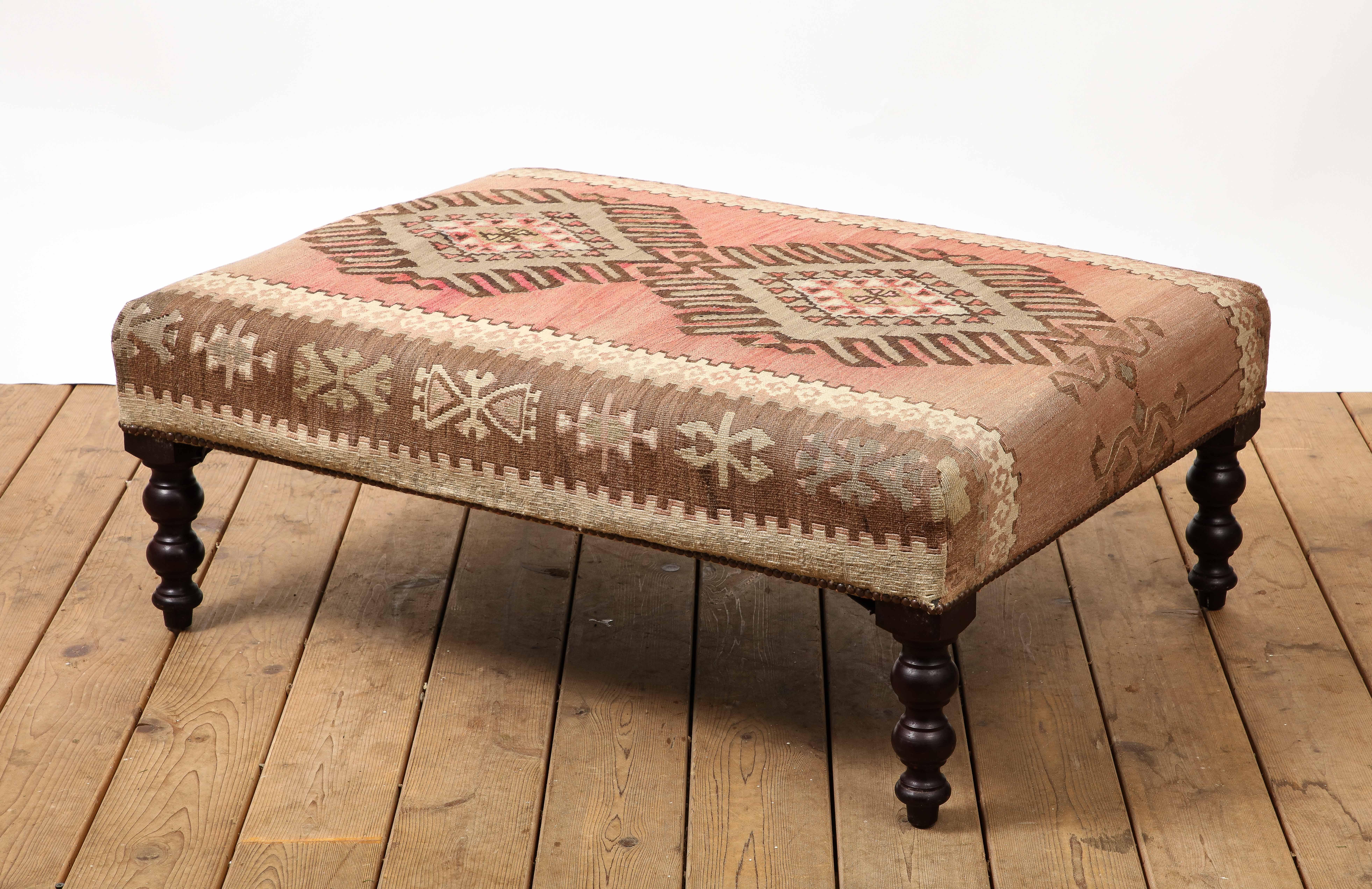 George Smith rectangular ottoman featuring unique kilim top, with nailhead trim and turned wood legs. 