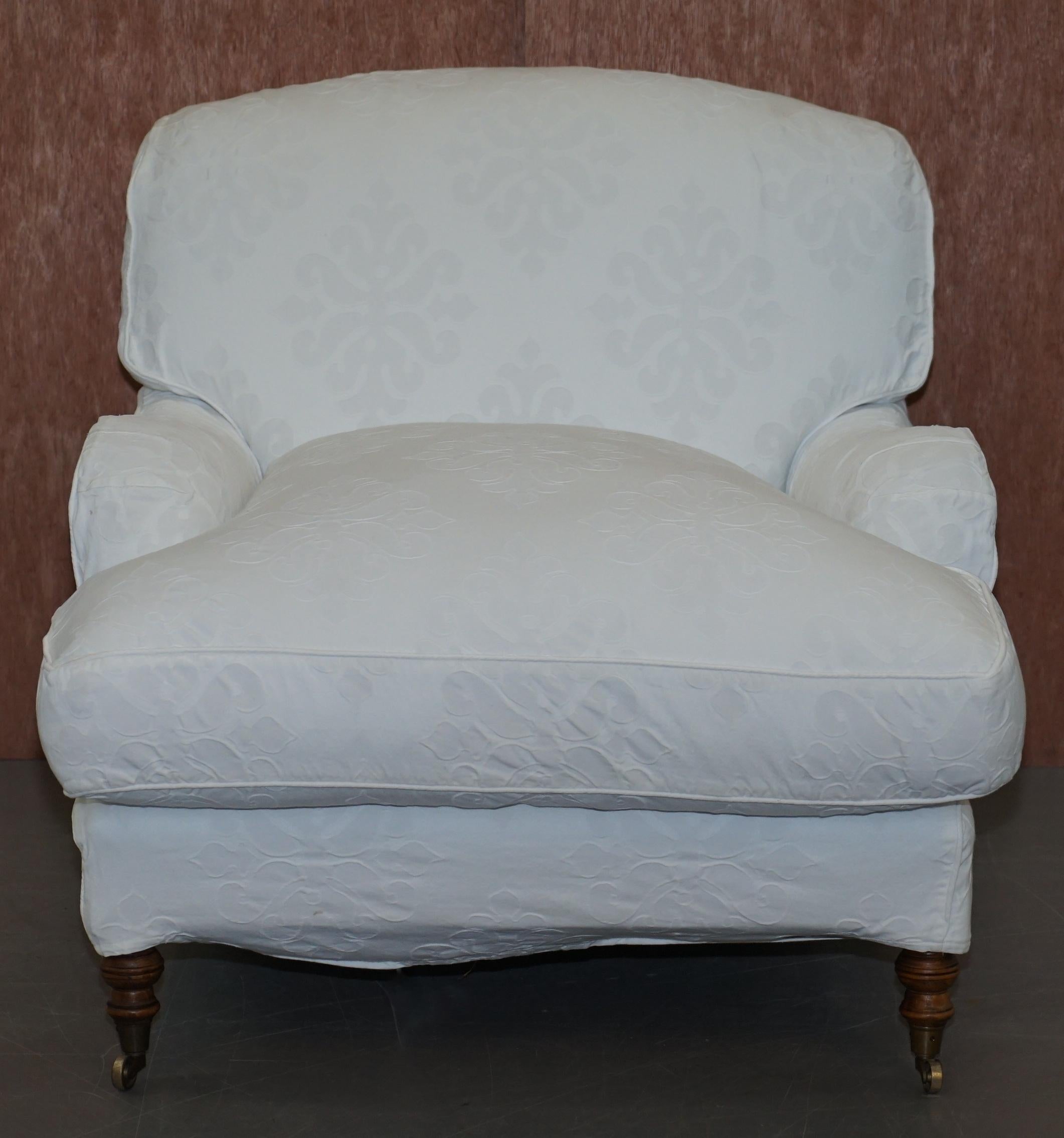 We are delighted to offer for sale this lovely original George Smith aignature scroll arm long platform base club armchair RRP £4900

A good looking and well made chair, it has a mahogany frame, the original castors, an over stuff feather filled
