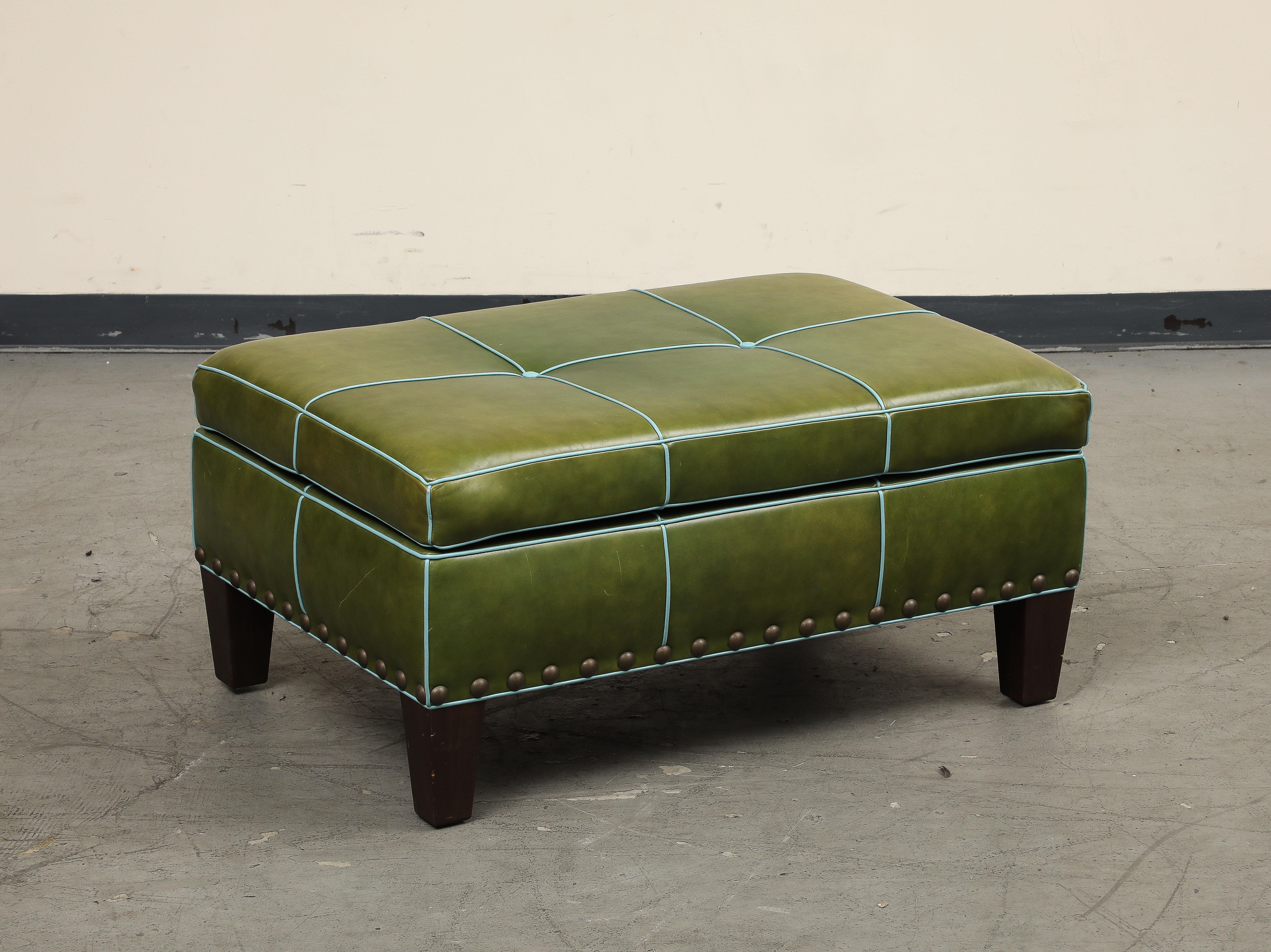 Late 20th century English George Smith style rectangular tufted ottoman, in green leather with contrasting sky blue welding. Two sky blue center buttons. Brass nail head detail around the base. 