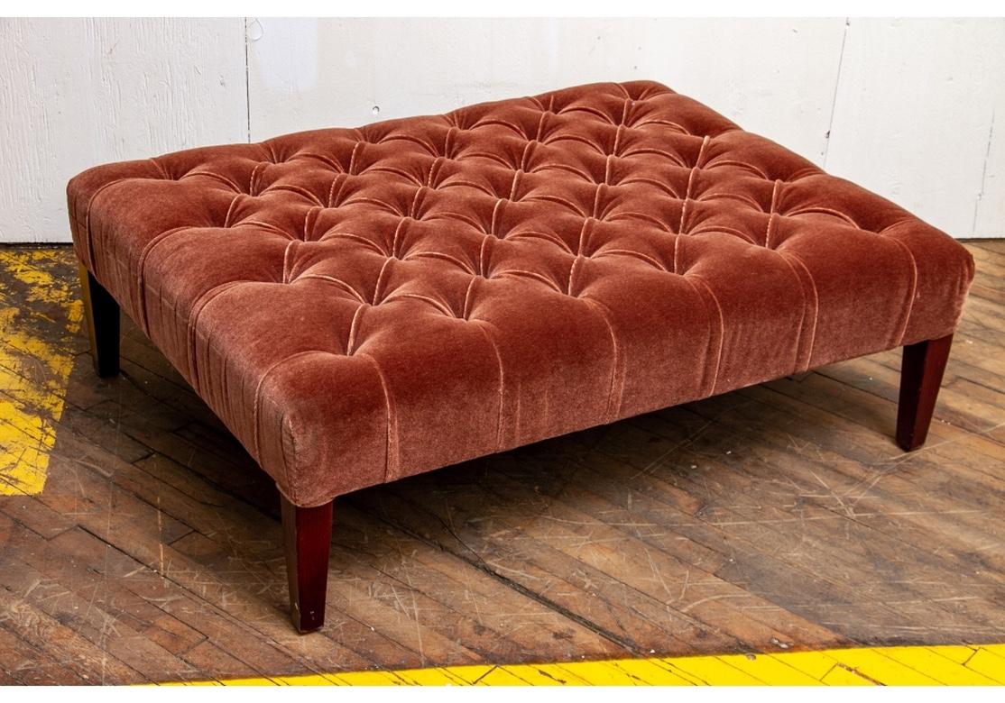 An older Classic George Smith Tufted ottoman custom upholstered in a Cocoa Mohair. The top button tufted, raised on square tapering stained hardwood legs showing fine graining. Sits very solidly with excellent proportions suitable for use as a