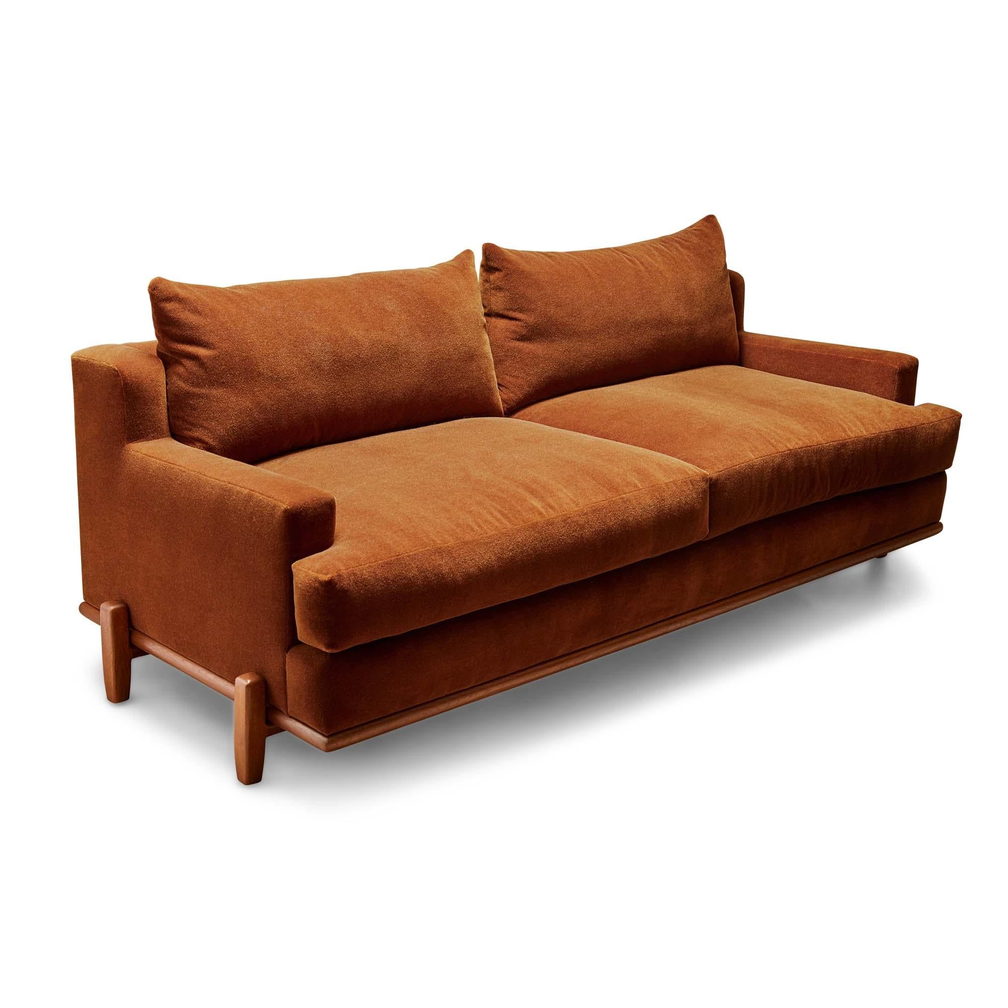 The George sofa is part of the collaborative collection with interior designer Brian Paquette. The low profile silhouette sits above a sculpted solid wood base. This piece is available in exclusive BP for LF finishes as well as the standard
