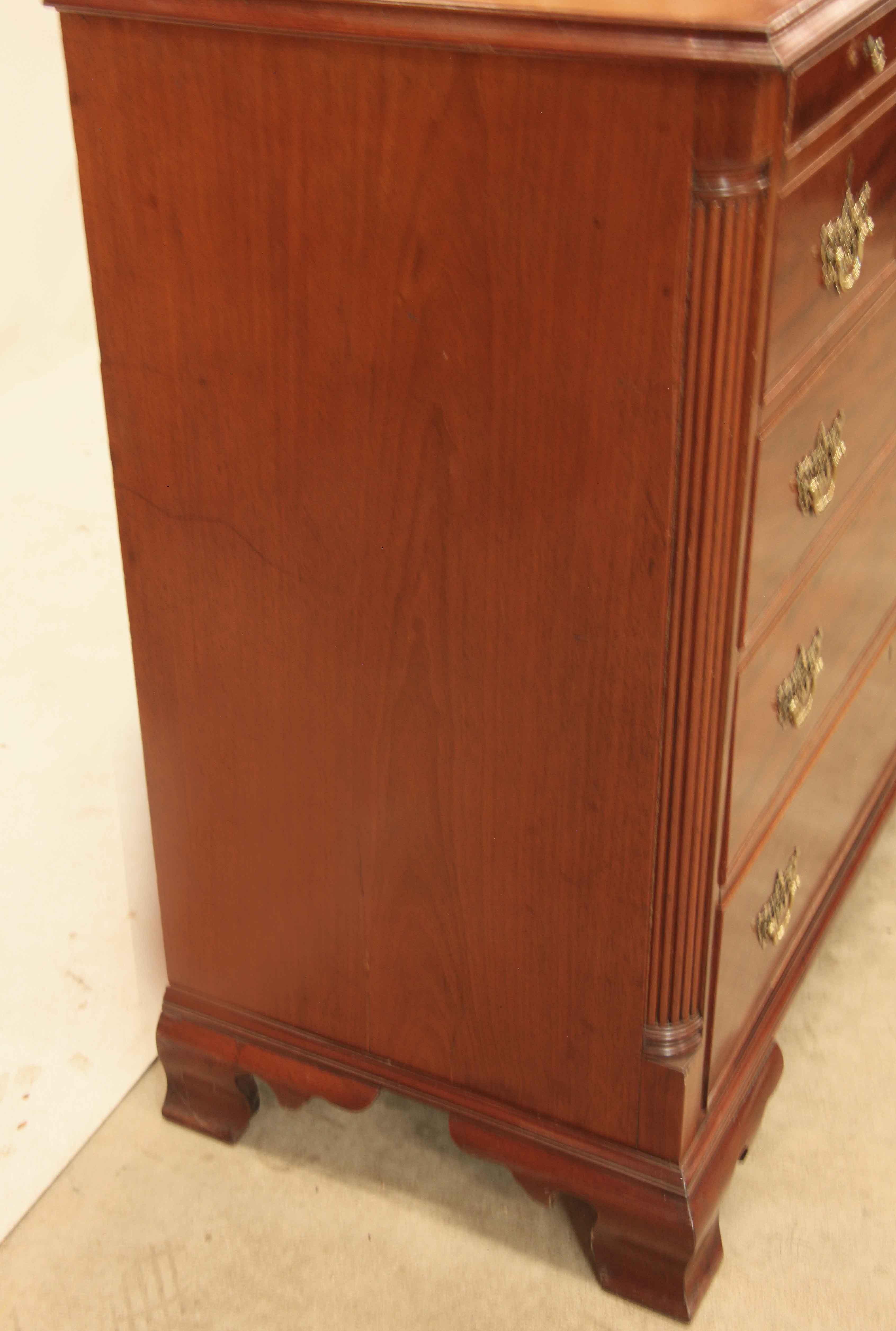George III three over three drawer chest, the top having beautiful mahogany grain ,  there are three narrow ''dummy'' drawers below the top, essentially for aesthetics.  The three over three graduated drawers also have outstanding figuring along