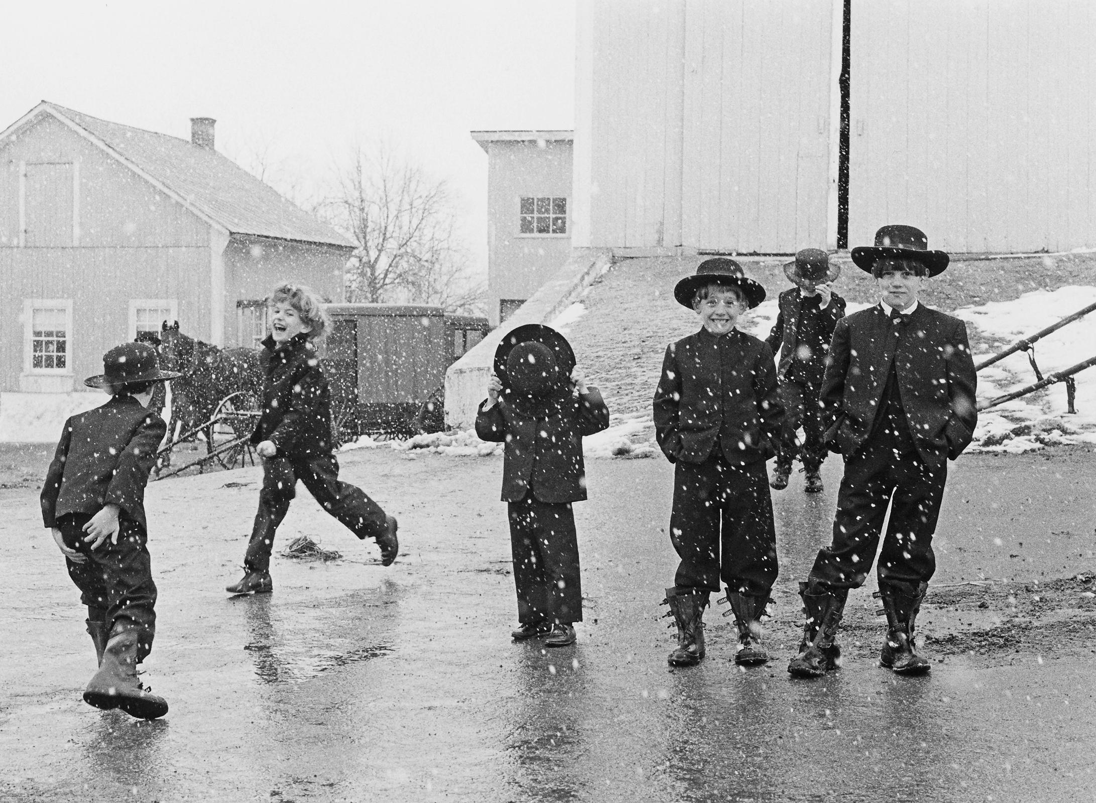 George Tice Black and White Photograph - Amish Children Playing in Snow, Lancaster, PA