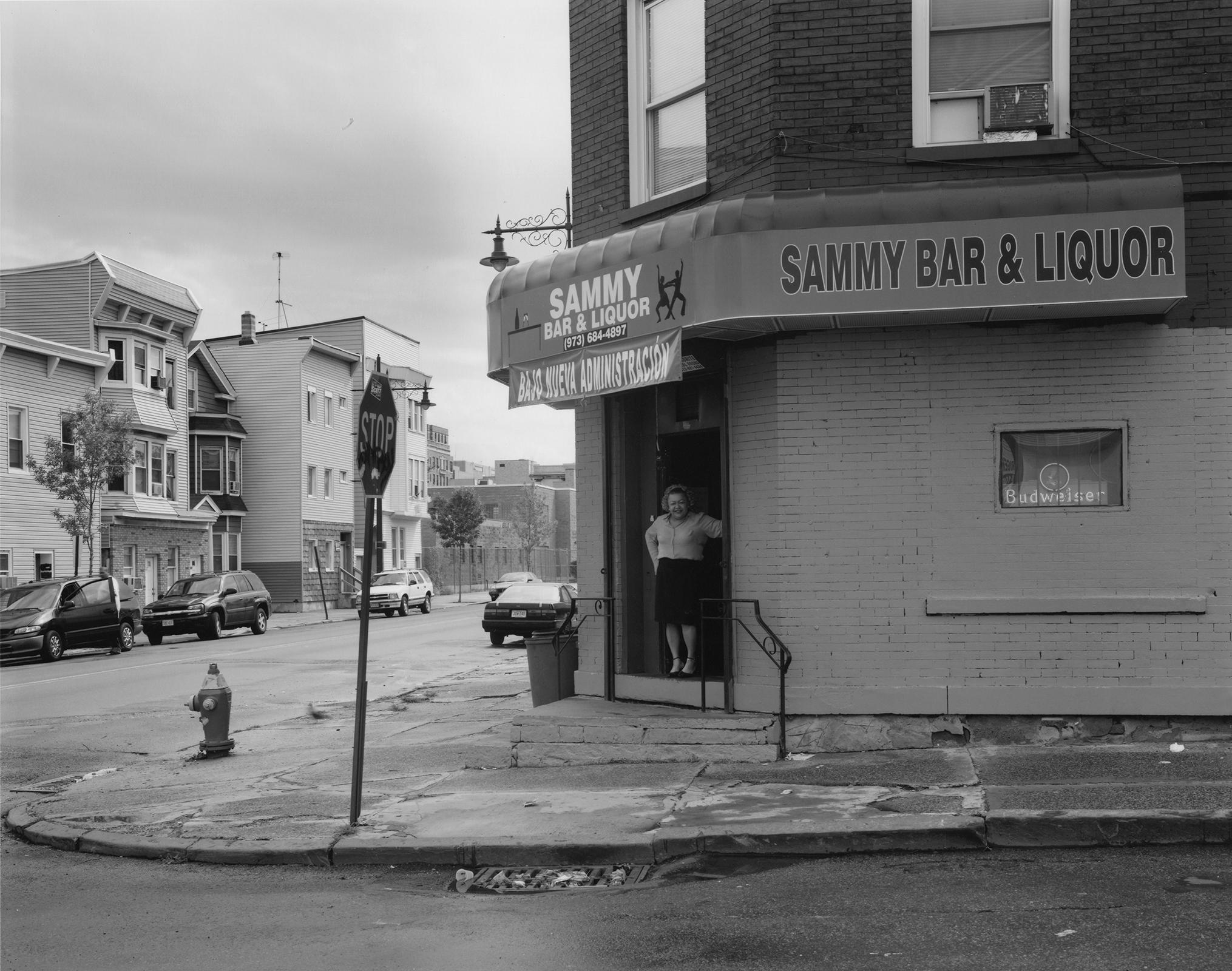 George Tice Black and White Photograph - Sammy's Bar, Main Street, Paterson, NJ