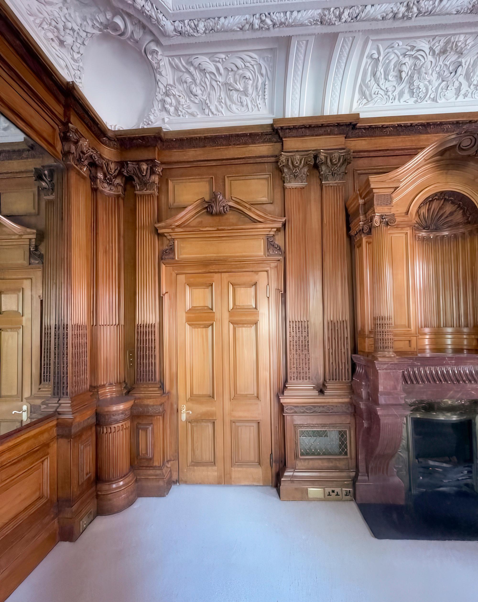 George Trollope and Sons. Exhibited at the Paris Universal Exhibition in 1878 winning a Gold Medal for Excellence.

The set forms the four sides of a complete panelled room that was exhibited as a boudoir room or petit salon at the Paris Exhibition