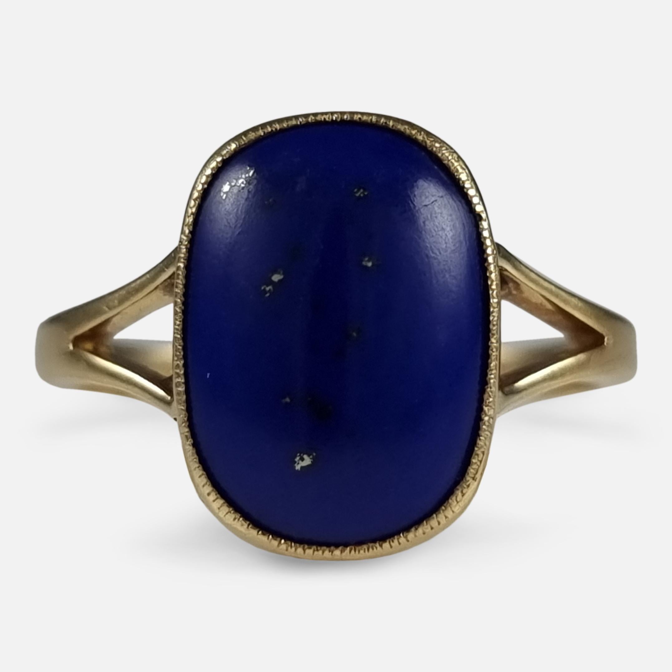 An antique George V 18ct yellow gold Lapis Lazuli cabochon ring. The oblong lapis cabochon is bezel set, leading to bifurcated shoulders, and plain gold shank.

The ring is hallmarked with Birmingham marks, date letter 'r' to denote 1916, and