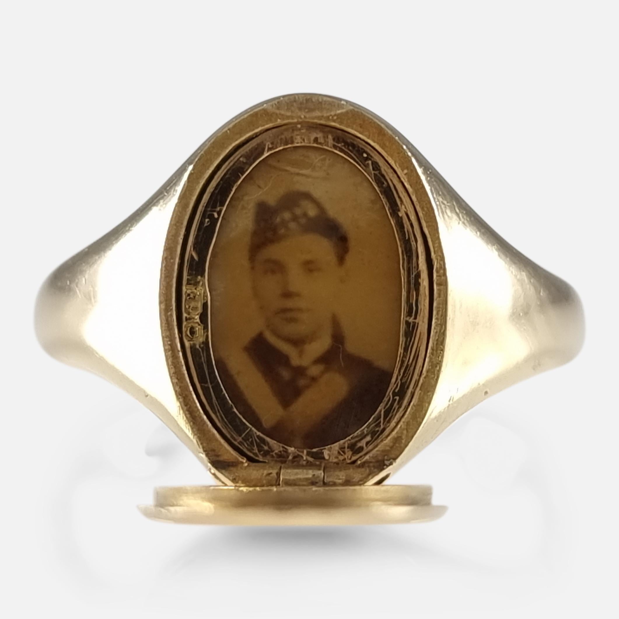 A George V 18 carat yellow gold portrait locket signet ring. The ring has an oval panel to the front engraved with The King's Royal Rifle Corps emblem, which hinges open to reveal a portrait of a gentleman in military uniform; leading to plain