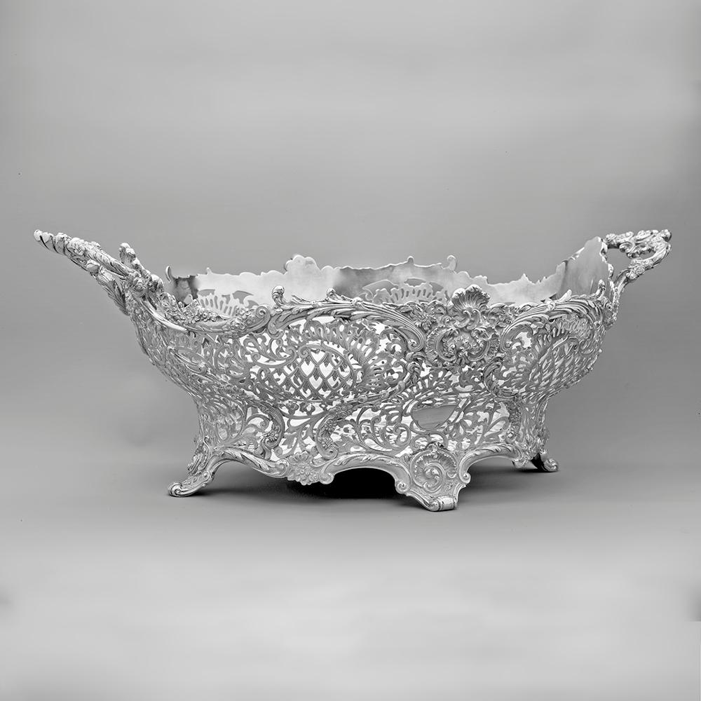 An exceptionally fine George V sterling silver fruit basket, made by the important maker Sebastian Henry Garrard. The shaped oval pierced basket with garlands and scroll work decoration.

Weight: 1,502.00 Grams

The company that was to become