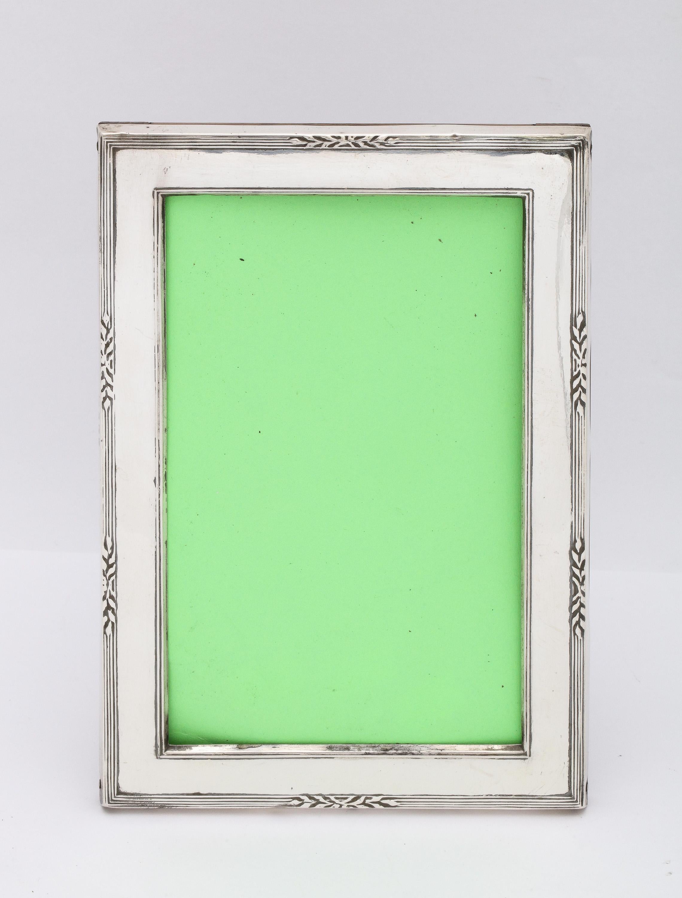 Edwardian-style, sterling silver-mounted wood - backed picture frame, Birmingham, England, year-hallmarked for 1928, Samuel McLardy - maker. Outer measurements of frame are 4 1/2 inches wide x 6 1/2 inches high x 3 3/4 inches deep (when easel is in