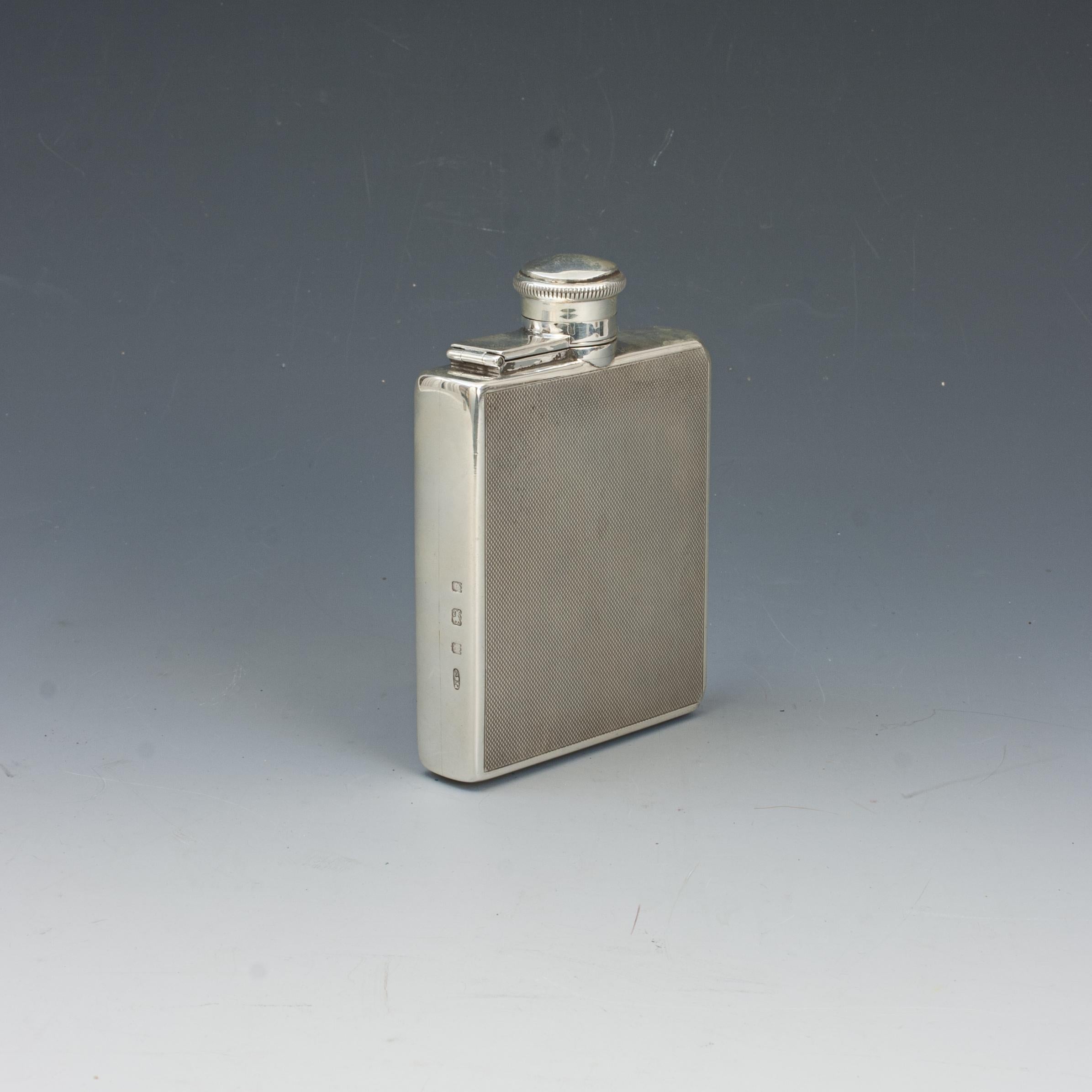 Padgett & Braham Art Decco Silver Hip Flask.
A beautiful gentleman's pocket silver spirit hip flask by Padgett & Braham Ltd, hallmarked London 1929. A rectangular form hip flask with hinged bayonet top. A beautiful piece with engine-turned finish.

