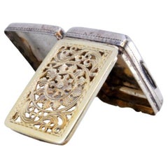 George V silver vinaigrette with relief lid 
gilded interior