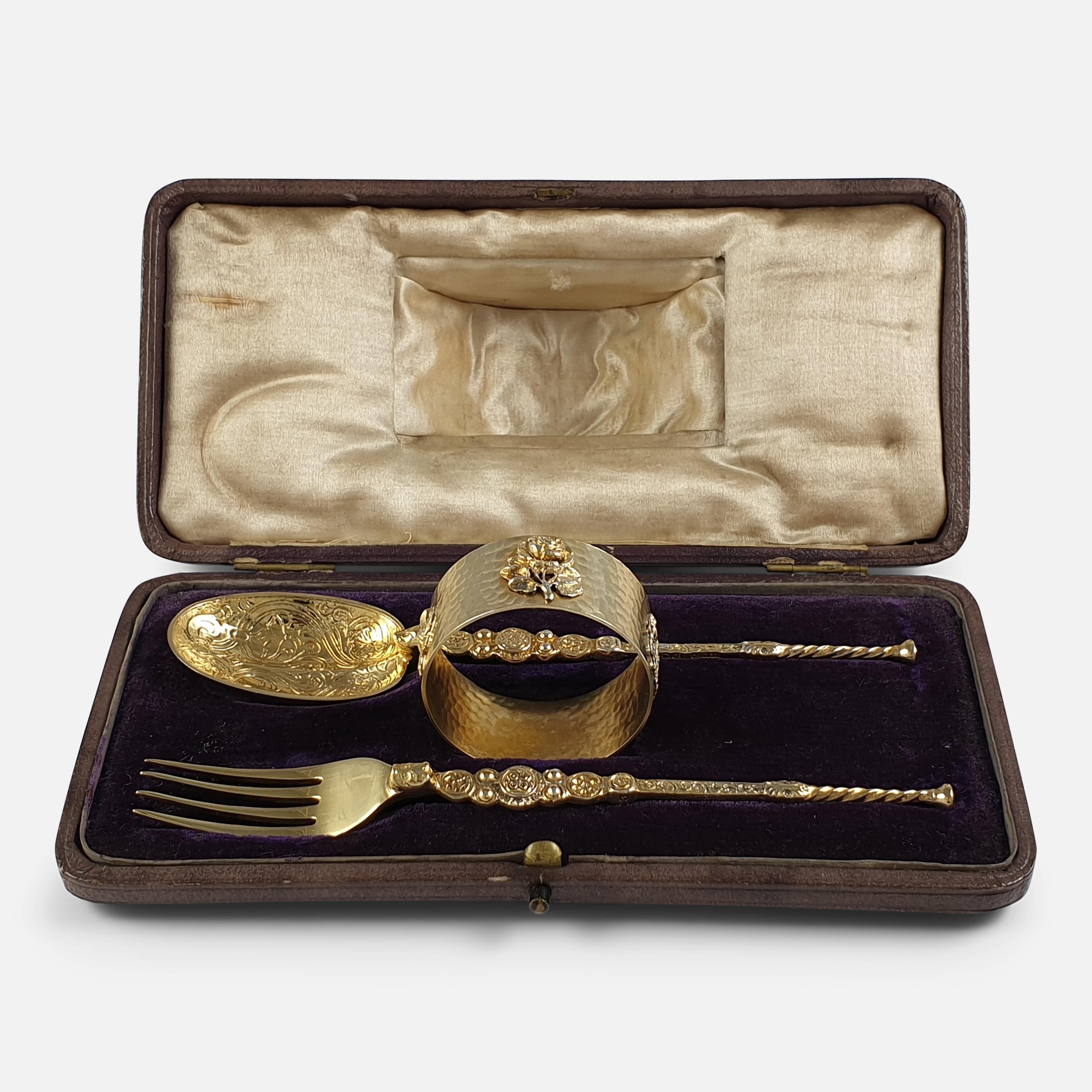 A sterling silver gilt 3-piece christening set that includes a 