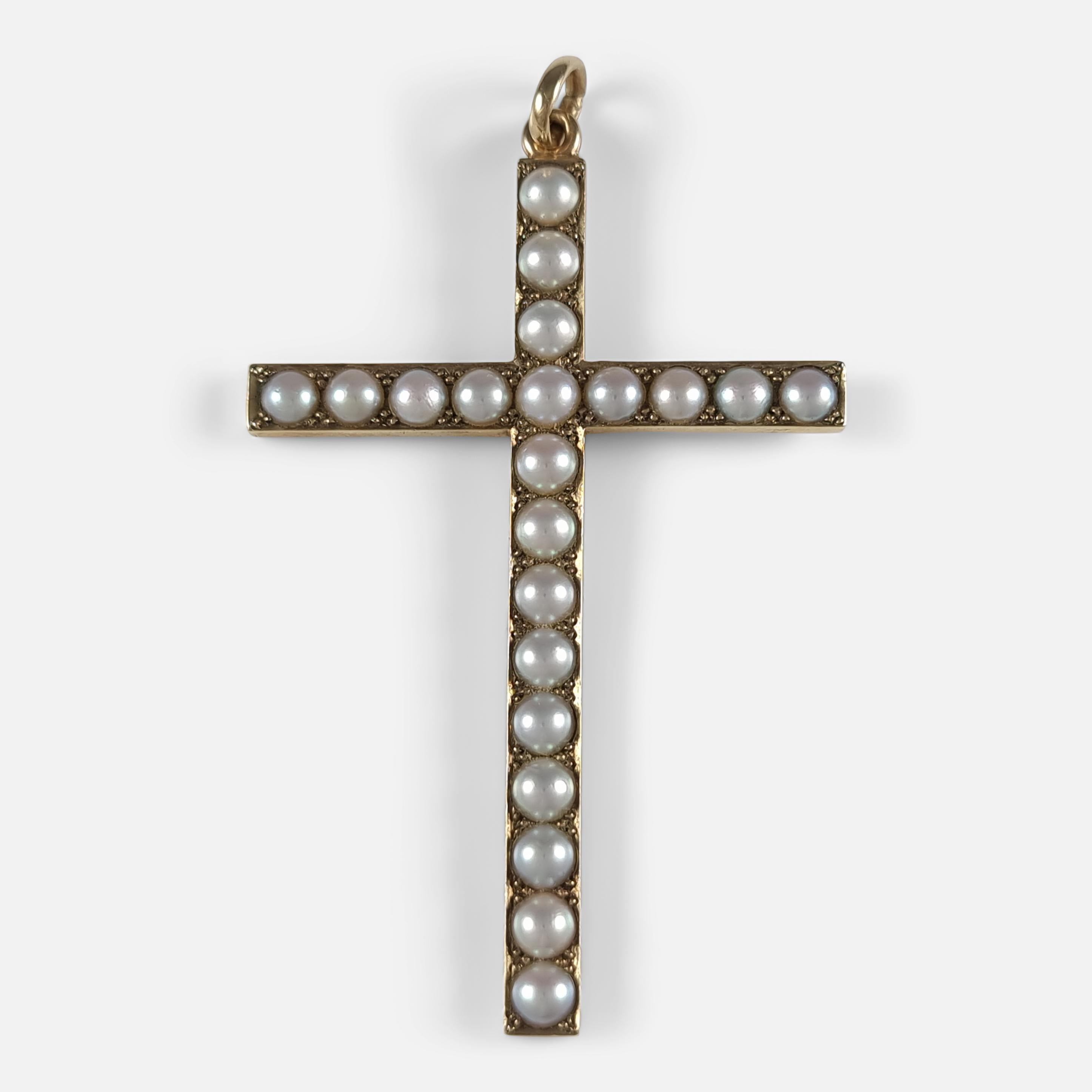 A George VI 9ct gold seed pearl cross pendant. The cross pendant is crafted in gold, and set to the front with 21 seed pearls.

Hallmarked with Birmingham assay marks, date letter 