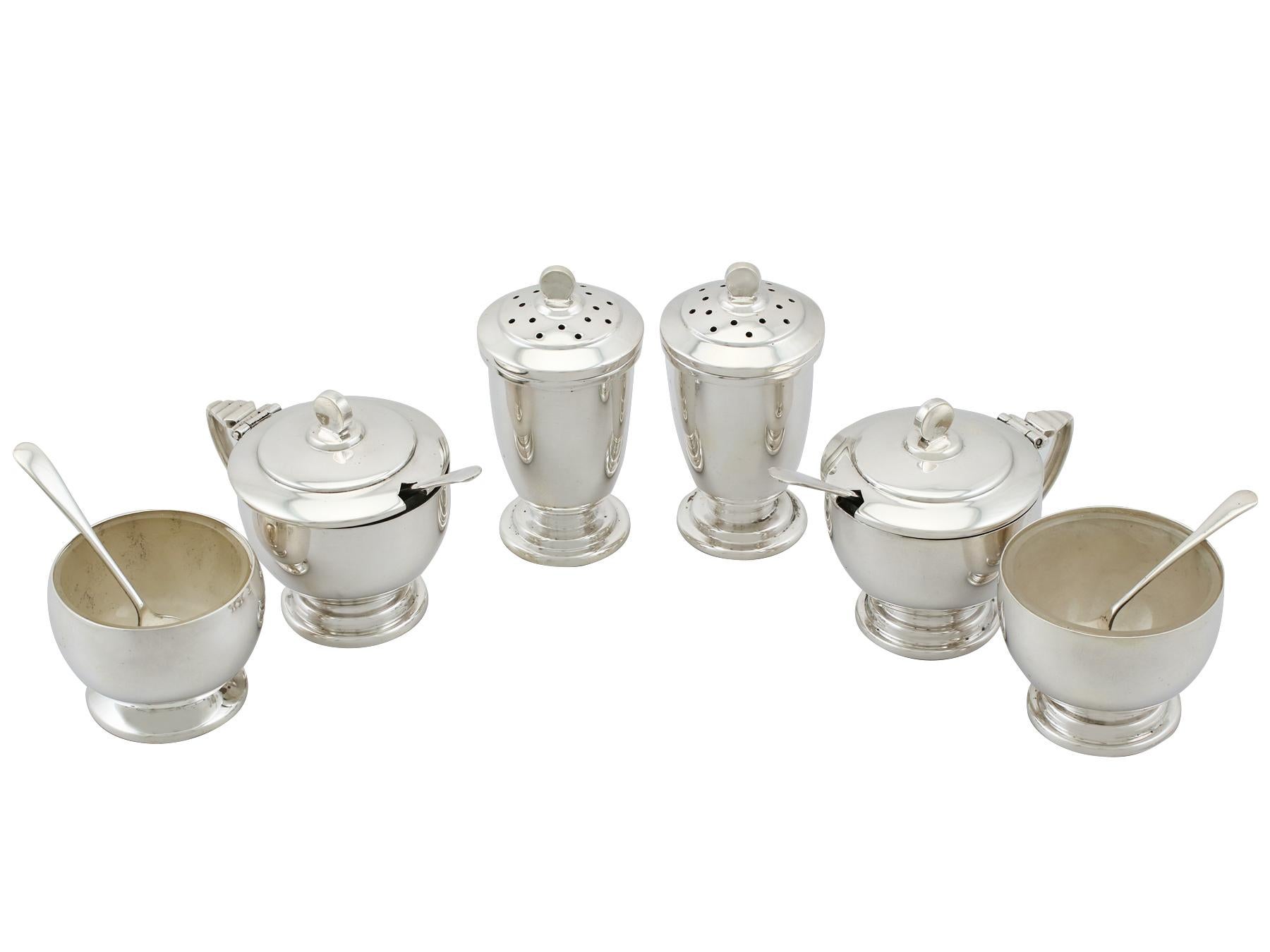 An exceptional, fine and impressive vintage Elizabeth II English sterling silver six piece condiment set in the Art Deco style - boxed; an addition to our dining silverware collection.

This exceptional vintage George VI sterling silver six piece
