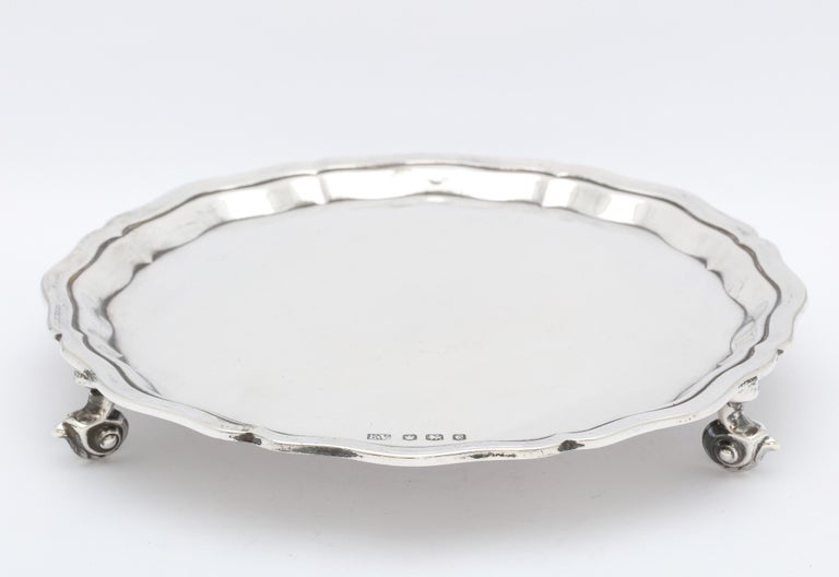 George VI Period, sterling silver footed salver/tray (in the George III Style), Sheffield, England, year-hallmarked for 1945, Emile Viner - maker. Scalloped border. Measures 8 inches diameter x 1 1/4 inches high. Weighs 10.235 Troy ounces. Dark