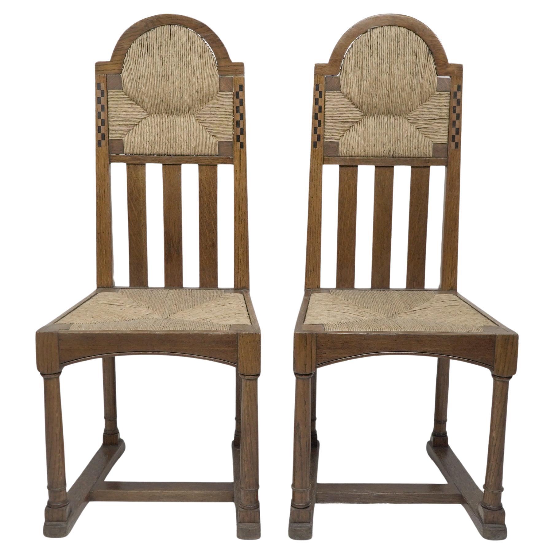 George Walton attributed, Pair of Arts & Crafts chairs with bold chequer inlays