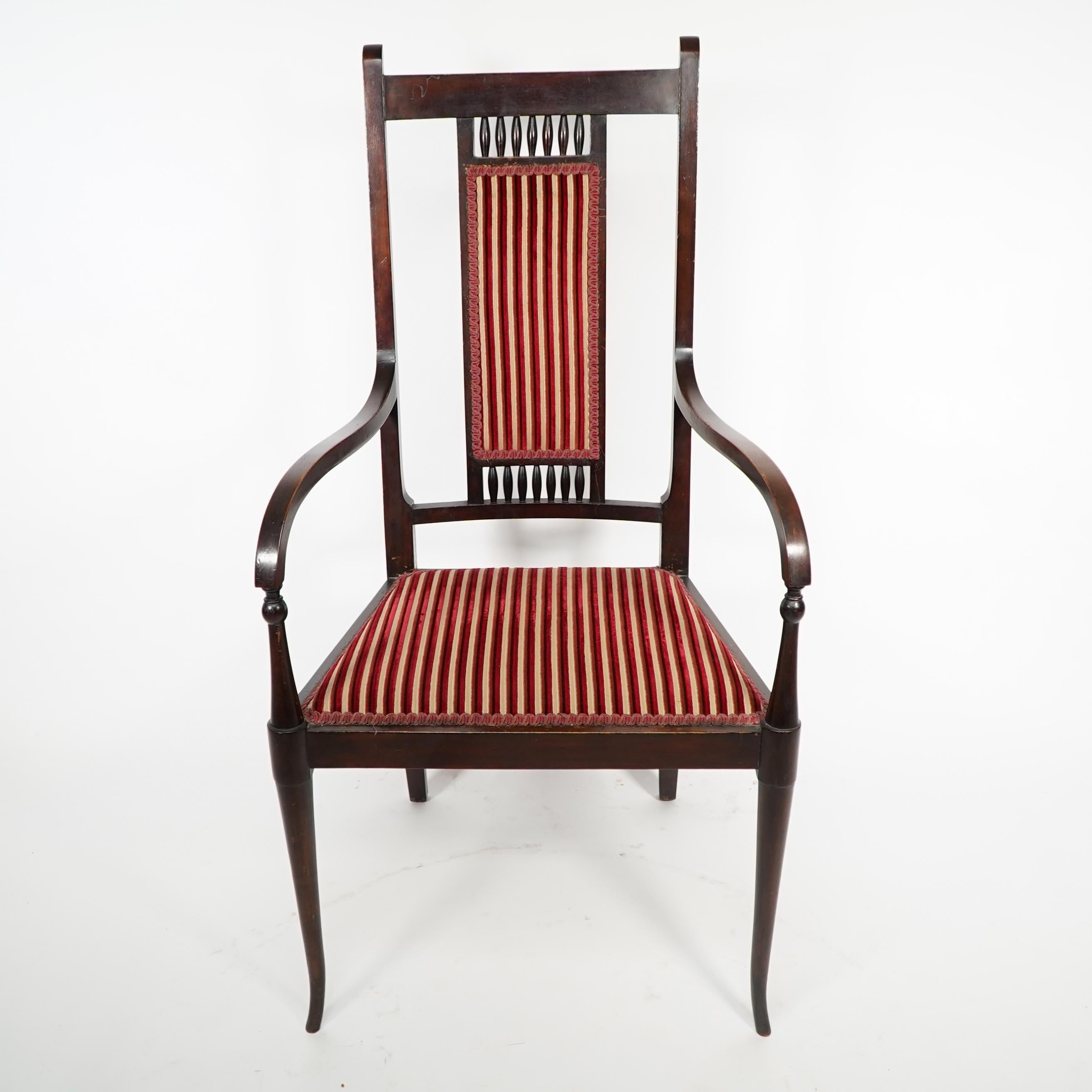 George Walton for John Rowntree's cafe & Miss Cranston tearooms. An Arts and Crafts walnut Armchair. George Walton first designed this armchair which had a cane seat and back, around 1896, the year he began designing the interiors of fashionable tea