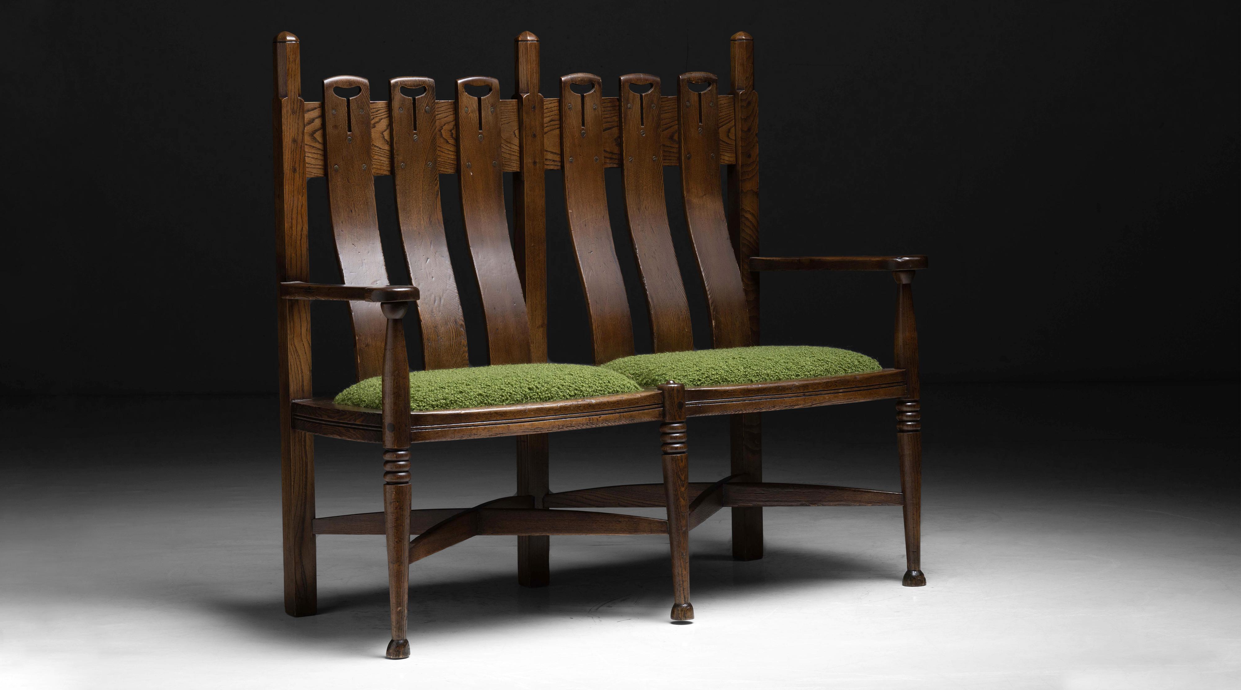 George Walton settle.

England, circa 1880.

Oak settle designed by George Walton, produced by William Birch of High Wycombe and retailed by Liberty of London, incredible original condition with dark finish and cushions newly upholstered in