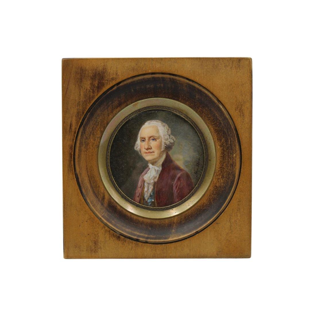 This is a small round portrait of George Washington, in a period wooden porthole frame. The portrait is undated but most likely from the mid to late 19th century.  The portrait depicts George Washington in three quarters pose, wearing a deep red