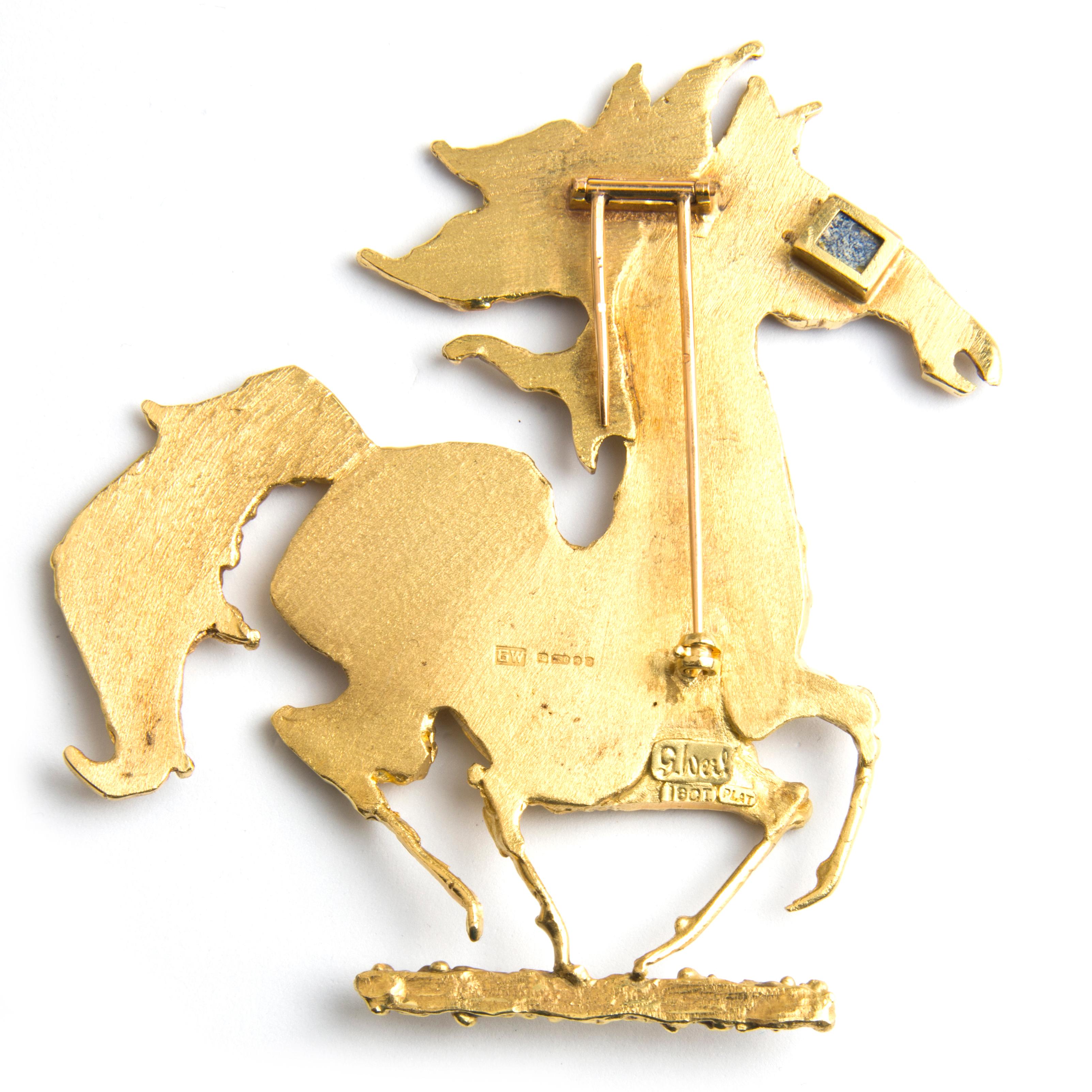 Brooch by George Weil designed as a galloping horse, yellow gold, with a Lapis Lazuli eye.
Signed G. Weil, maker's mark, English hallmarks, marked 18k and PLAT
1970s
Unique

George Weil is a London jeweller who made a career in the 1960s and 70s.