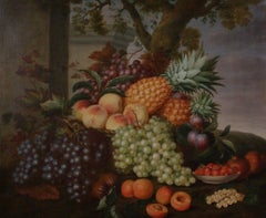 Still life of pineapples, peaches, grapes, plums and other fruit in a landscape 