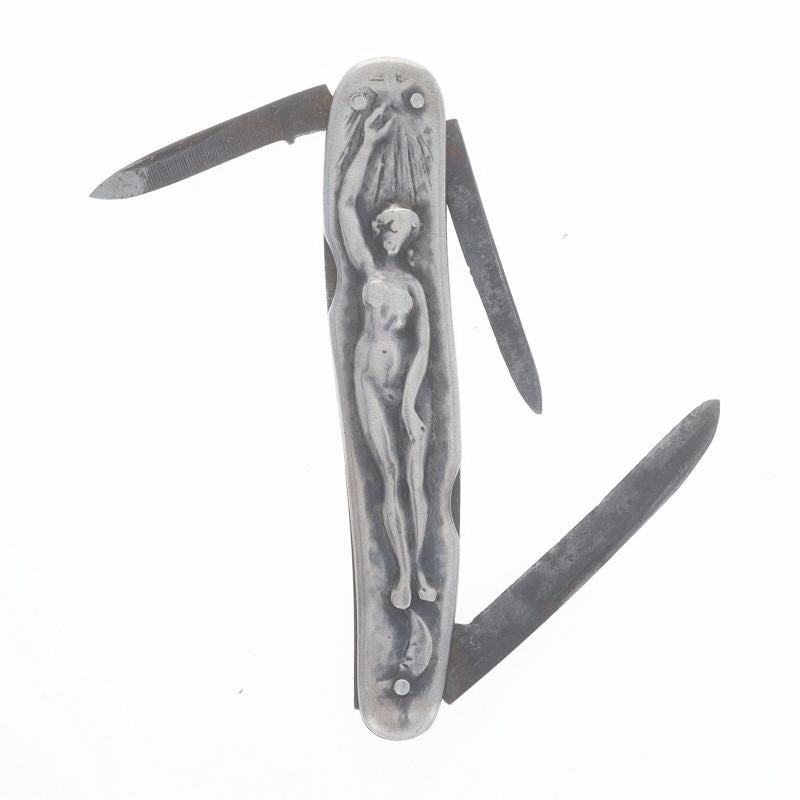 Brand: George Wostenholm
Design: Nude Moon Star
Era: Art Deco
Date: 1920s - 1930s

Metal Content: Sterling Silver

Style: Folding Pocket Knife
Theme: Celestial Figure
Features: Two Blades & One File

Measurements
Tall: 3