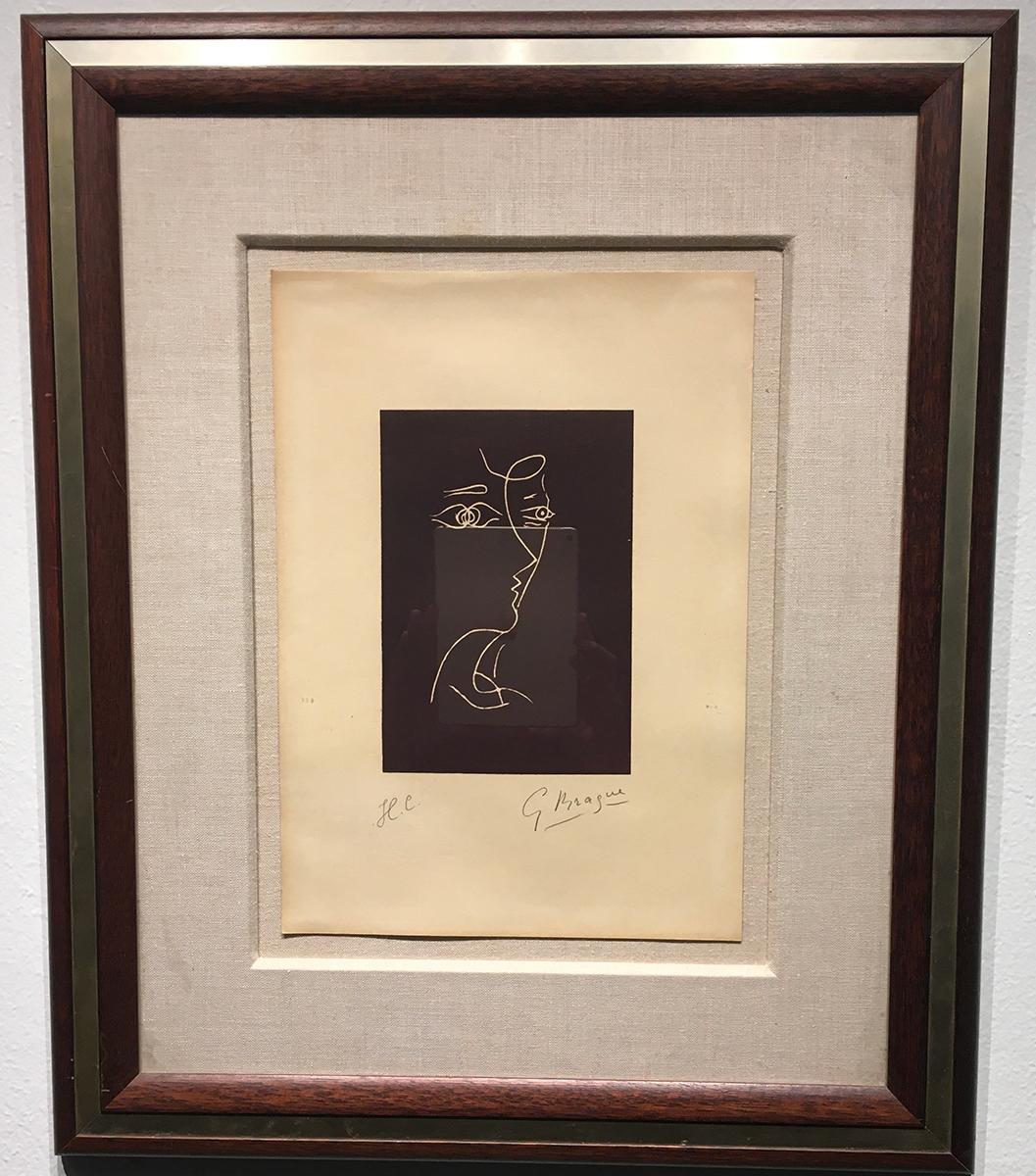 This 26" x 21.75" lithograph was produced by Georges Braque in 1960. The work presents a minimalist portrait rendered in a fluid contour line drawing style, emblematic of early 20th-century explorations into abstraction. Executed with deliberate