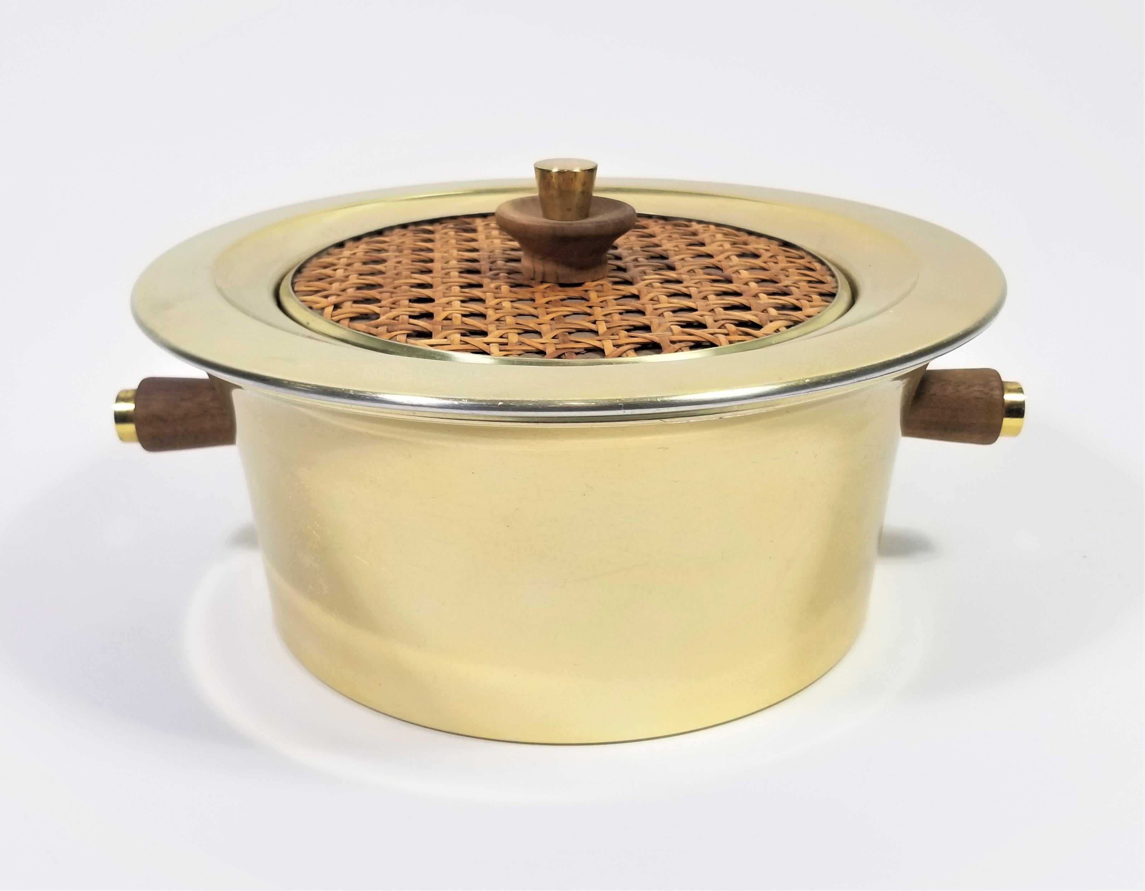 1960s Mid Century Signed Georges Briard Lidded Serving Bowl. Brass plated bowl and lid with decorative caning or rattan on lid. Wooden handles with brass accents. Removable Pyrex Glass Bowl. 