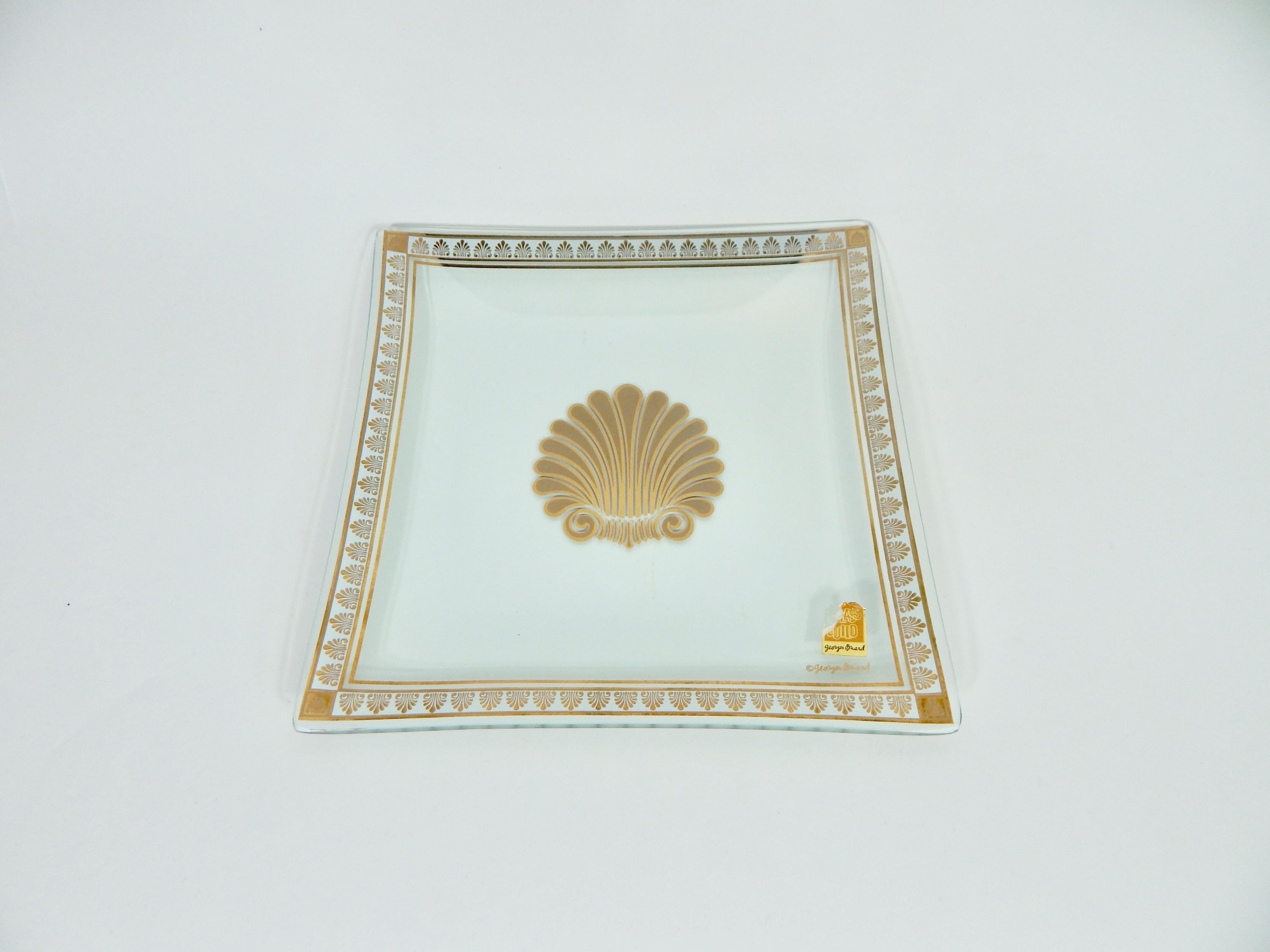 Georges Briard decorative dish or plate. Still retains original tag. Georges Briard signed. Clear glass with gold accents. Excellent condition.