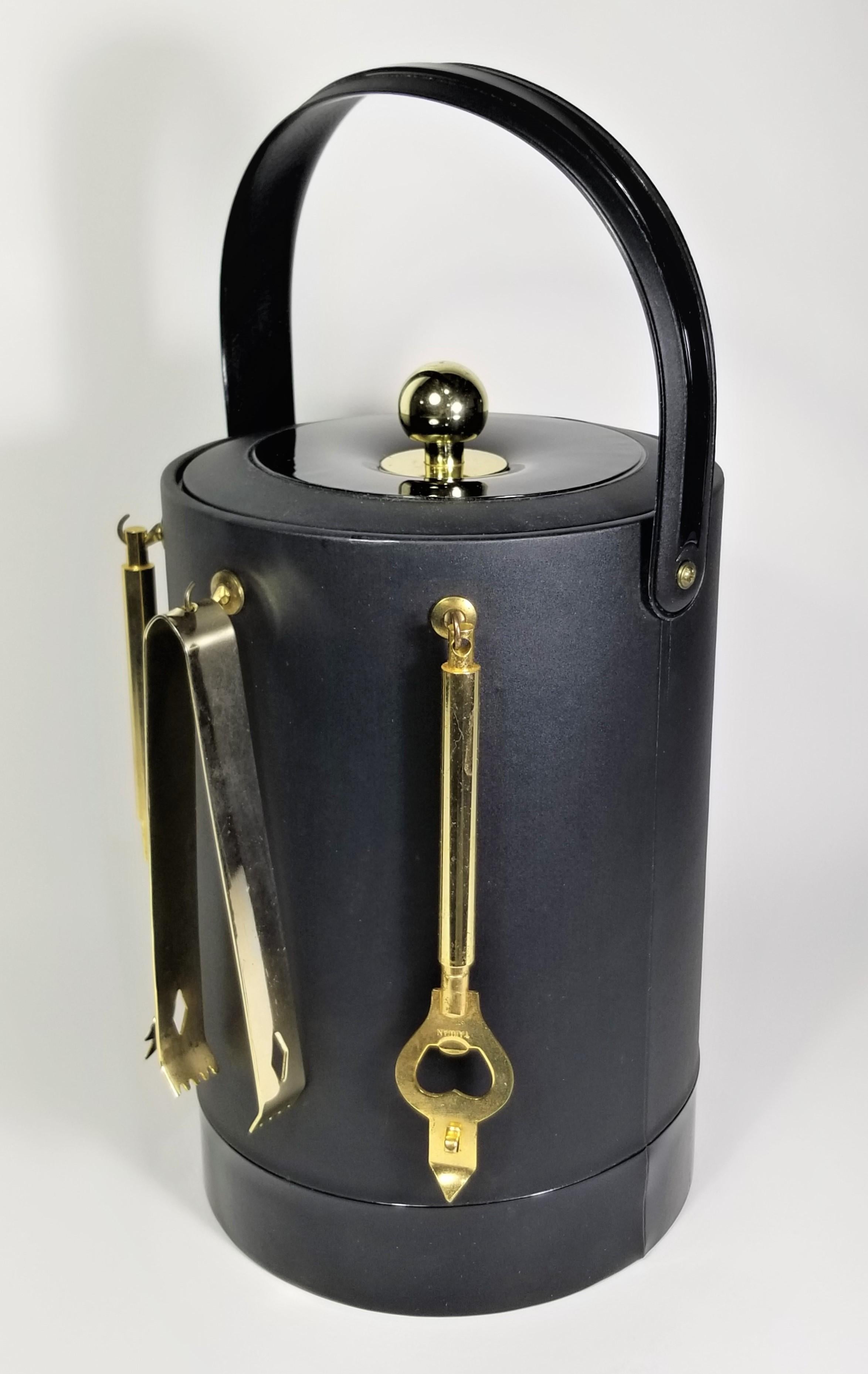Mid Century 1960s Georges Briard Signed Barware. Black Ice Bucket with Gold Utensils. 

Measurements:
Height with Handle Up: 16.0 inches
Height with Handle Down: 12.75 inches
Diameter: 9.0 inches