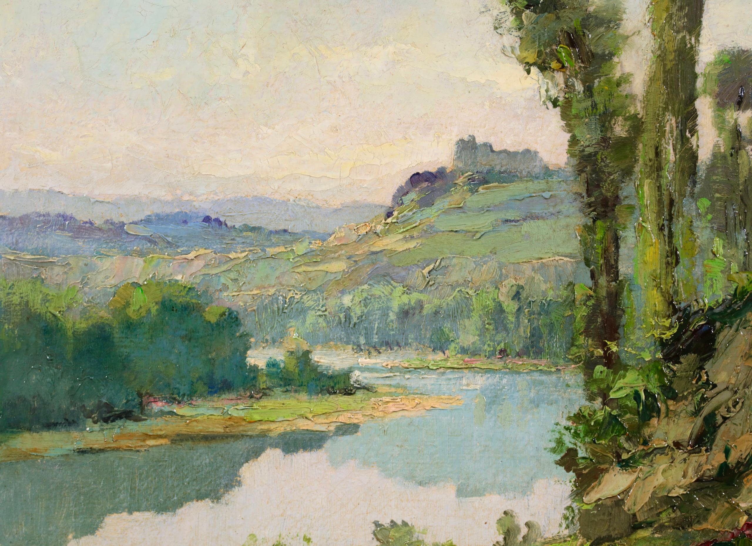 Signed oil on board riverscape circa 1950 by French Post Impressionist painter Georges Charles Robin. The work depicts a view of the Dordogne river on a sunny day. The green trees and shrubs that line the landscape create blue shadows in the water