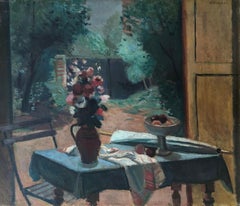 Table fleurie et vue sur le jardin