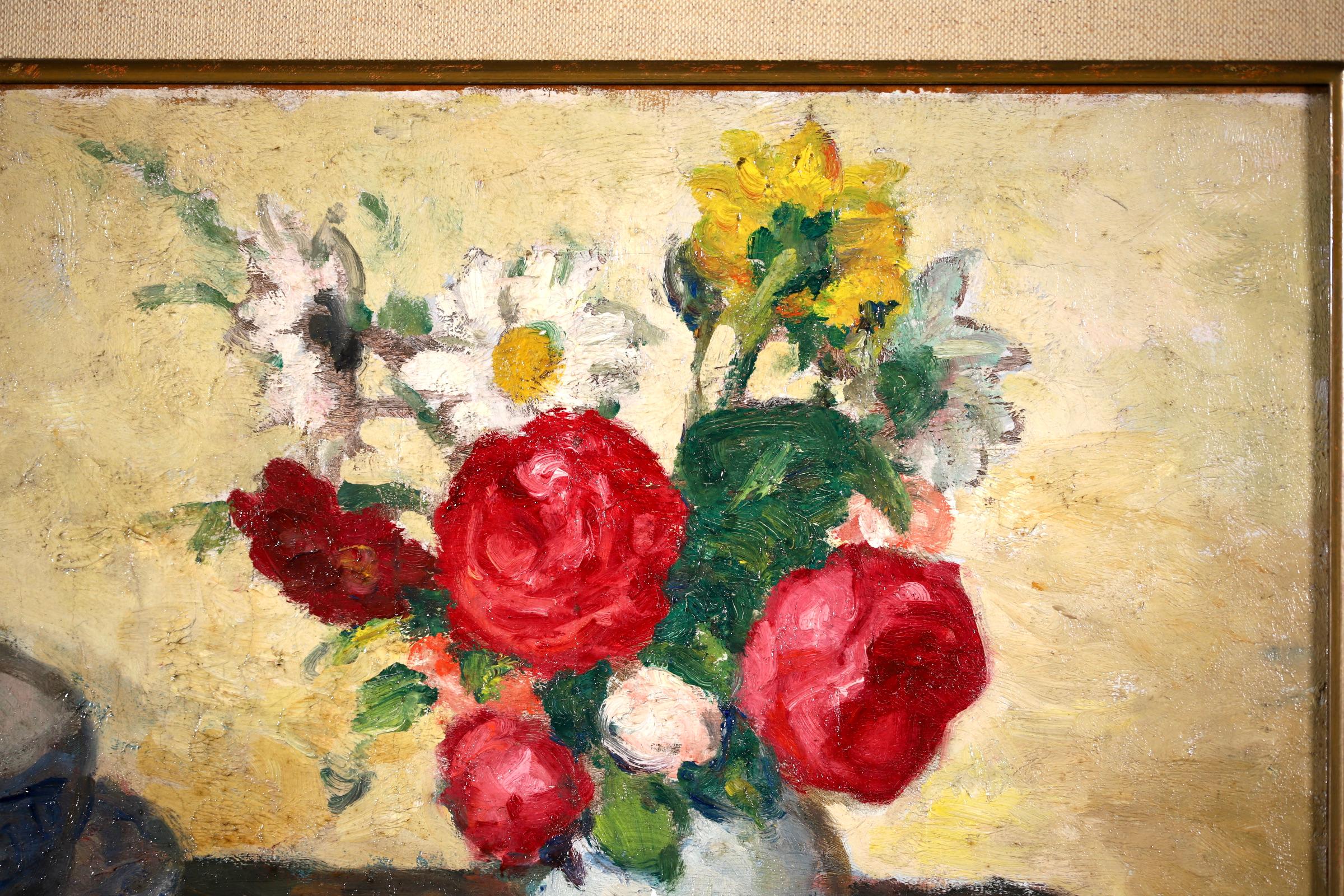 A beautifully painted oil on canvas circa 1920 by French post impressionist painter Georges D'Espagnat. The piece depicts a still life scene. To the right a white ceramic vase is filled with red, white and yellow flowers and to the left there is a