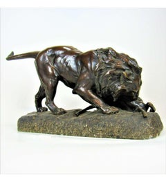 Georges Gardet - (1863-1939)+ Fonte en bronze,  Lion dévorant une antilope