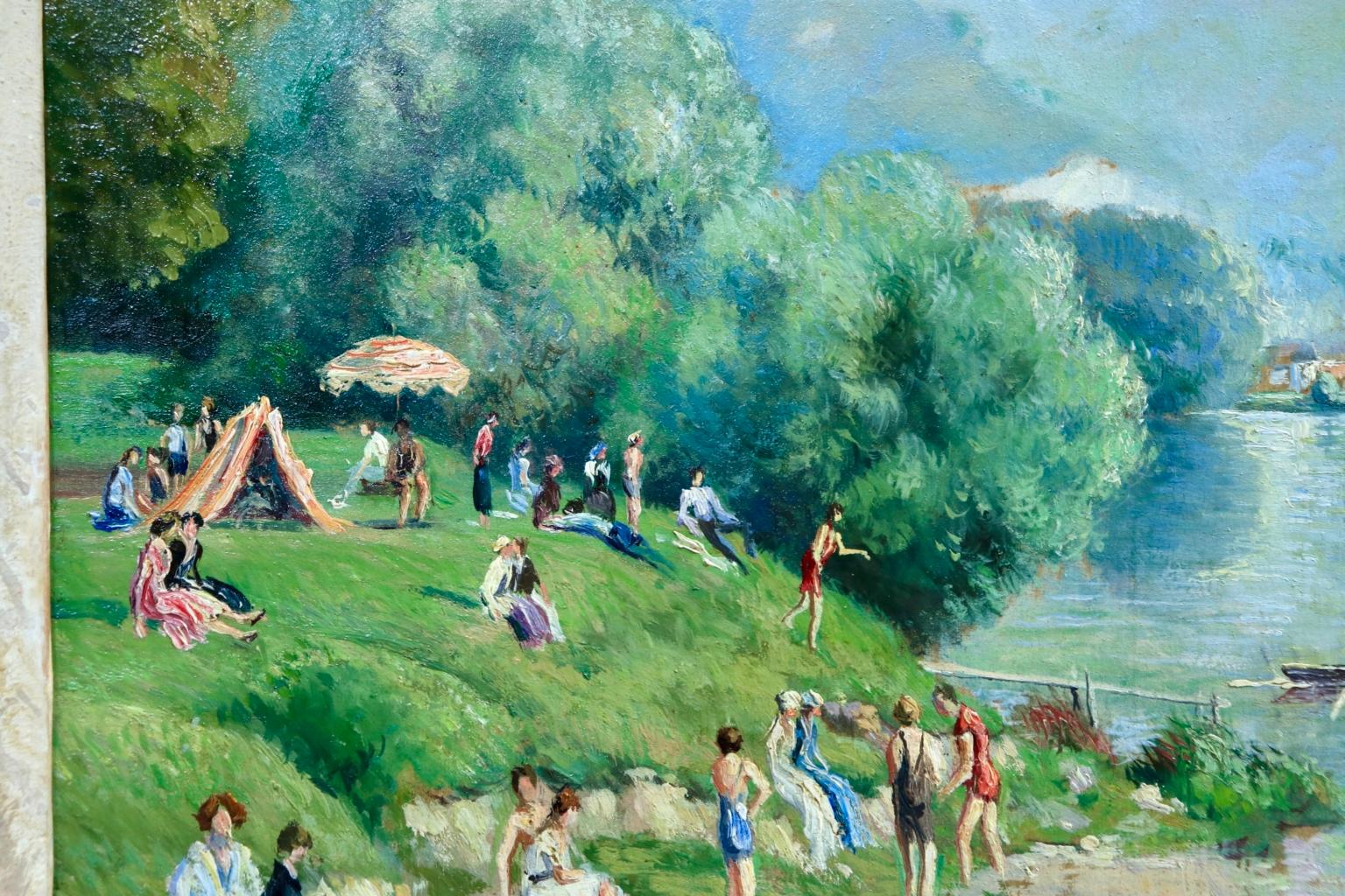A wonderful oil on board by French post-impressionist painter Georges Manzana Pissarro depicting bathers sunbathing and paddling in the river on a warm summer's day. Signed lower left and signed & titled again verso. A certificate of authenticity