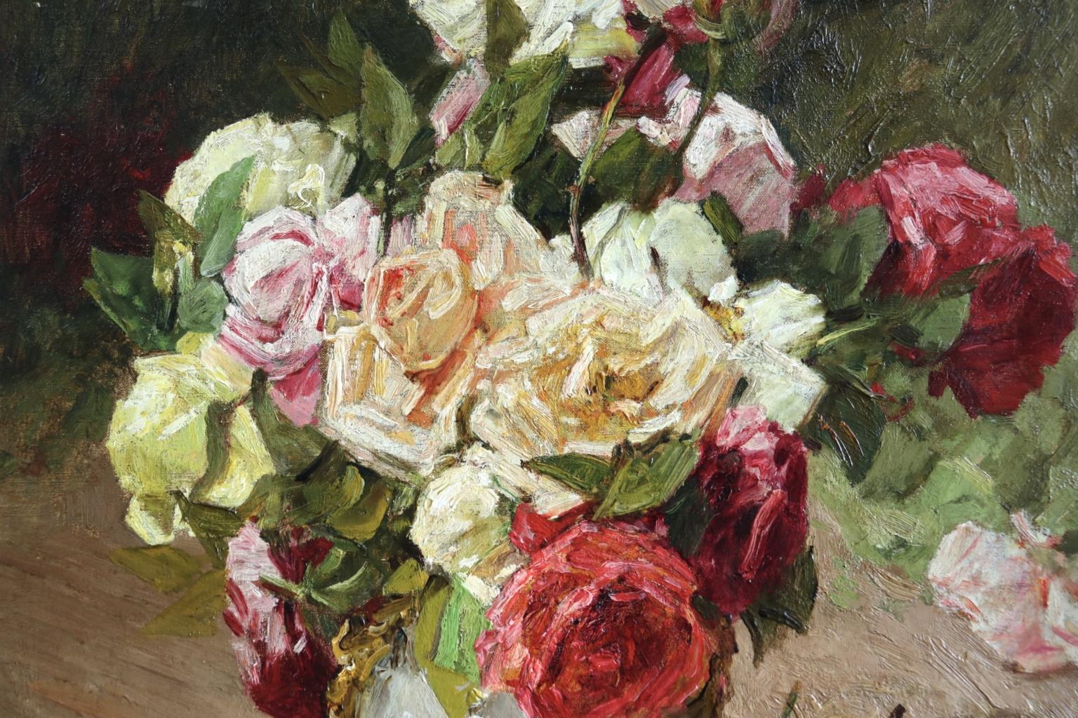 A wonderful oil on canvas by Georges Jeannin depicting a ceramic vase filled with red, pink, cream and peach coloured roses in an interior. Signed and dated 1910 lower left. Framed dimensions are 30 inches high by 26 inches