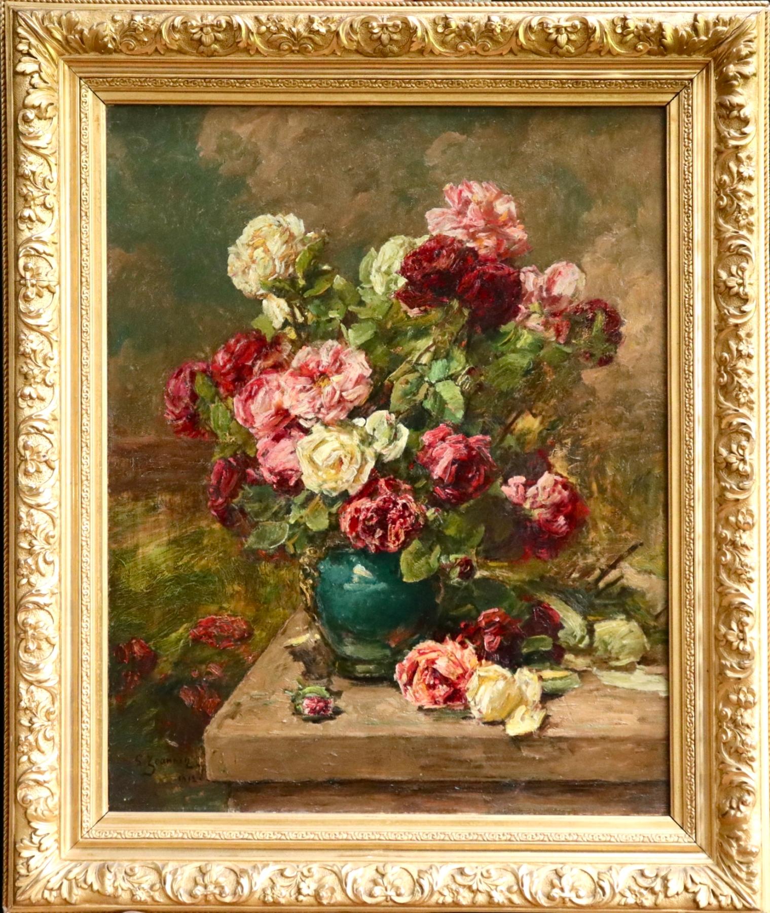 A lovely oil on canvas by Georges Jeannin depicting a green ceramic vase filled with red, pink and cream flowers on a wooden table in an interior. 

Signature:
Signed and dated lower left 

Dimensions:
Framed: 40