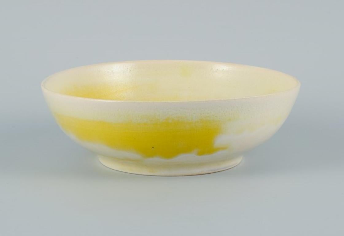 Georges Jouve (1910-1964), France. 
Unique bowl in glazed stoneware in yellow and cream shades.
Approx. 1960.
Signed.
In perfect condition.
Dimensions: 21.5 x 7.5 cm.

Georges Jouve was a French ceramicist considered one of the most important