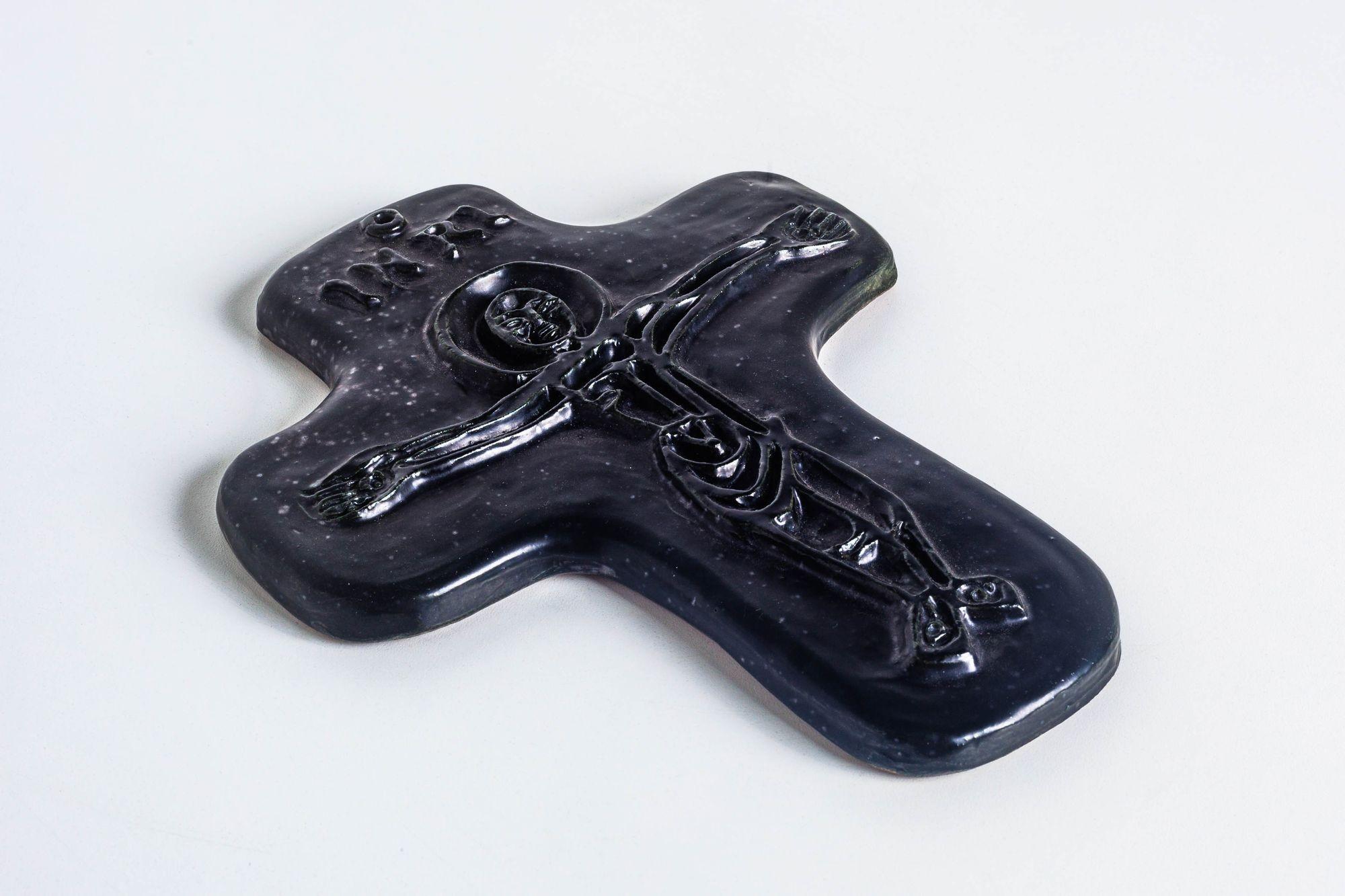 Georges Jouve Crucifix in Black glazed earthenware
Inscribed to top 'INRI'.
Incised signature and artist's cipher to verso ‘Jouve’.