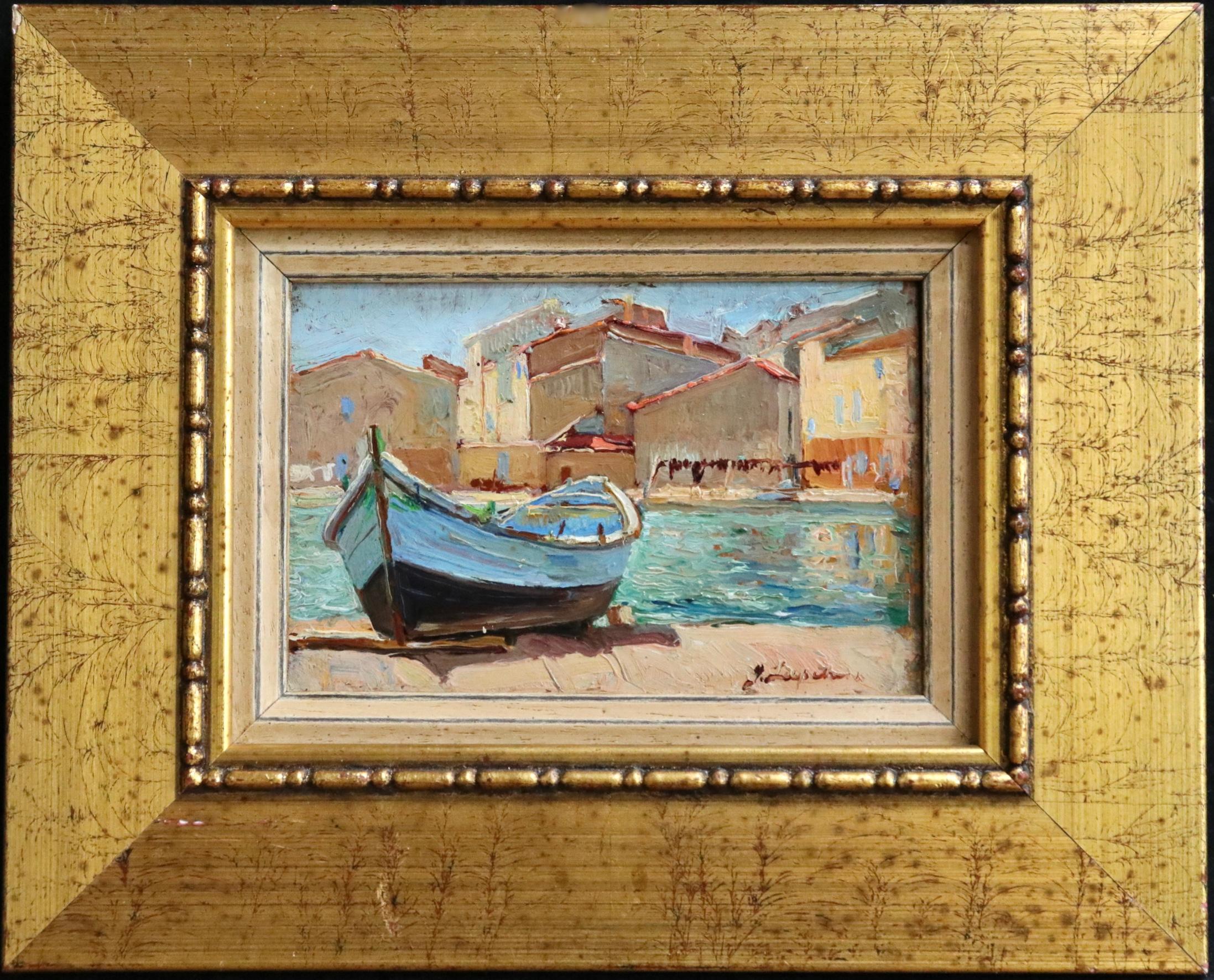 A colourful oil on board circa 1920 by Russian painter Georges Lapchine depicting the canal at Martigues in the south of France on a sunny day. There is a small boat to the foreground and houses beyond. Signed lower right. Framed dimensions are 9