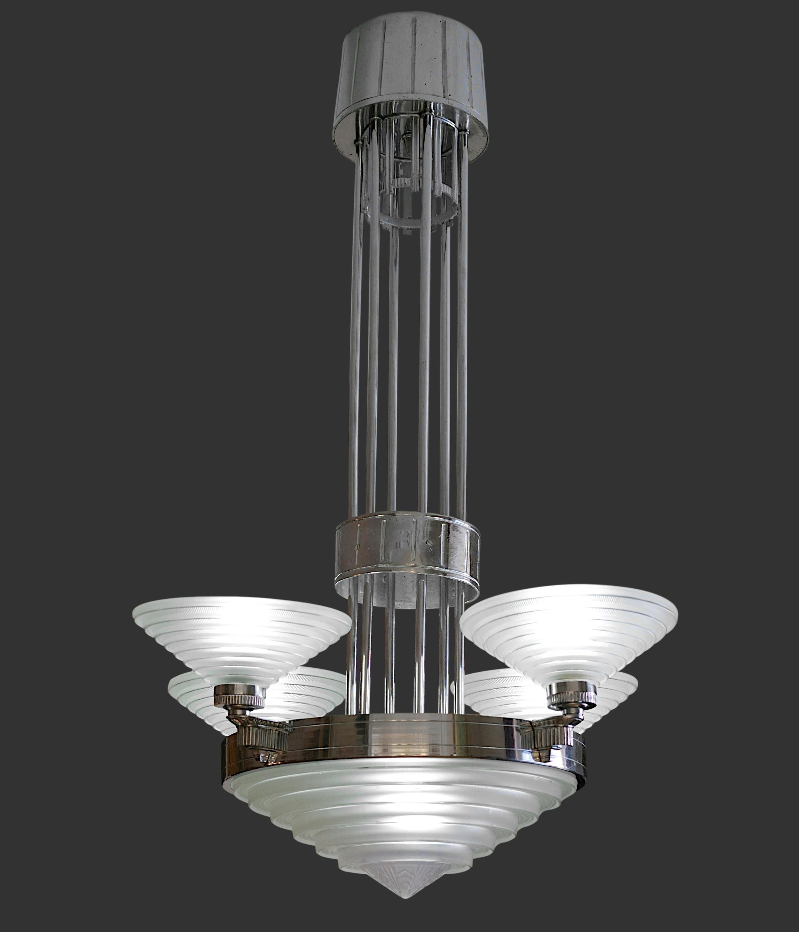 Genuine French Art Deco modernist chandelier by Georges LELEU, 53, rue Faubourg Saint-Antoine, 11e, France, 1920s. Chromed nickel and molded glass. The glass shades were made by Verrerie des Hanots. Height: 28.3
