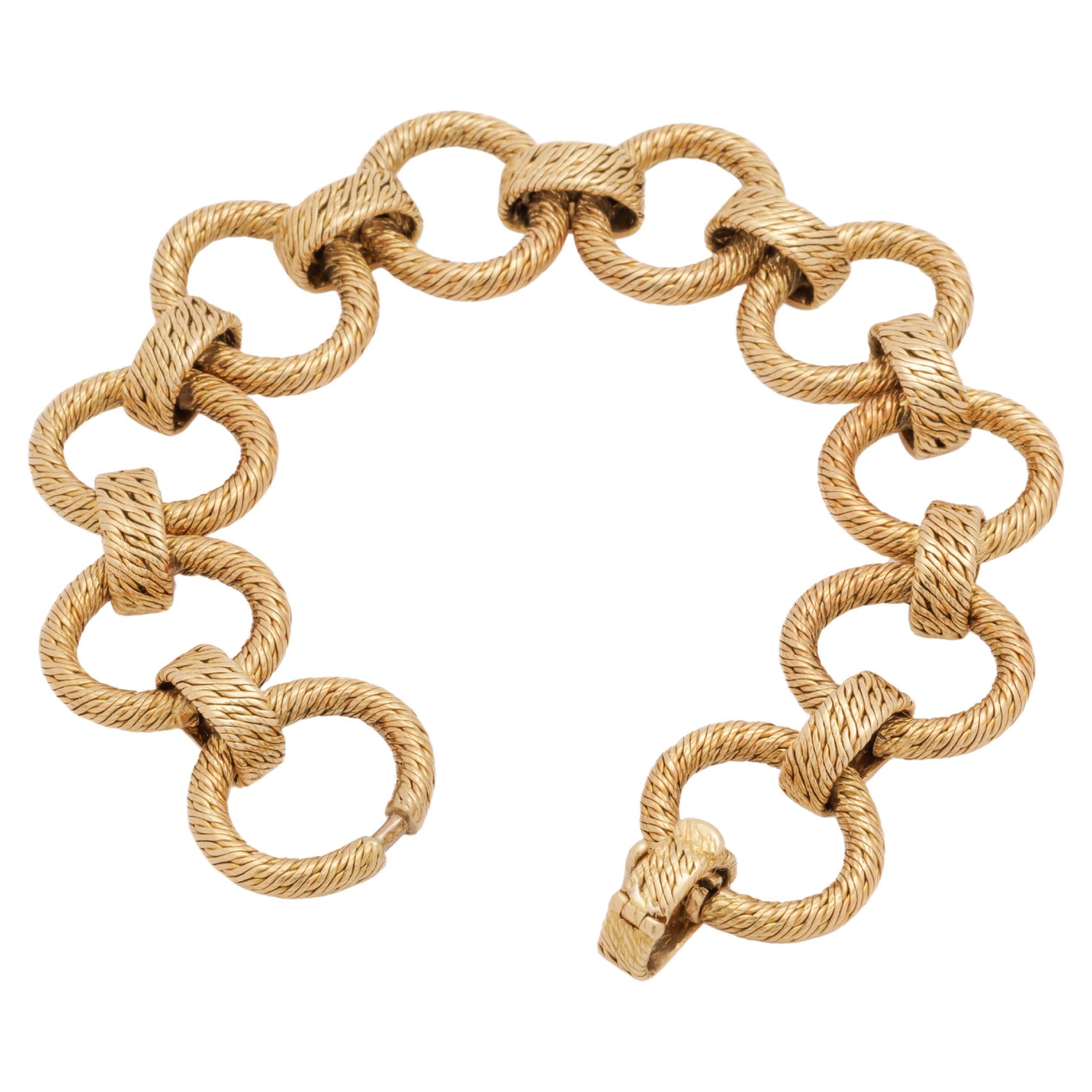 Gewebtes Armband mit Kreisen aus 18 Karat Gelbgold von Georges Lenfant im Angebot