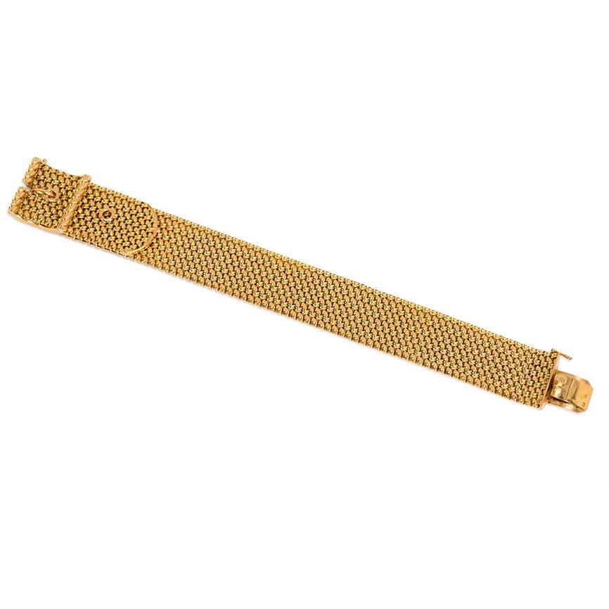 A mid-century woven gold strap bracelet with a buckle closure, in 18k. Georges L'Enfant, France.  In wonderful condition