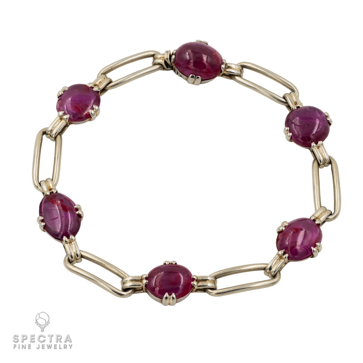 Sometimes a simple design is best when showing off gorgeous gemstones. Here the cabochon rubies are the stars of the show, supported attractively by an openwork link chain. The oval and rectangle shapes play off each other nicely. The Georges